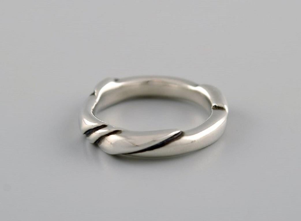 Ole Kortzau for Georg Jensen. Ring in sterling silver. Model 238. 
Late 20th Century.
Width: 5 mm.
Diameter: 17 mm.
US size: 6.5.
In excellent condition.
Stamped.
In most cases, we can change the size for a fee (50 USD) per ring.