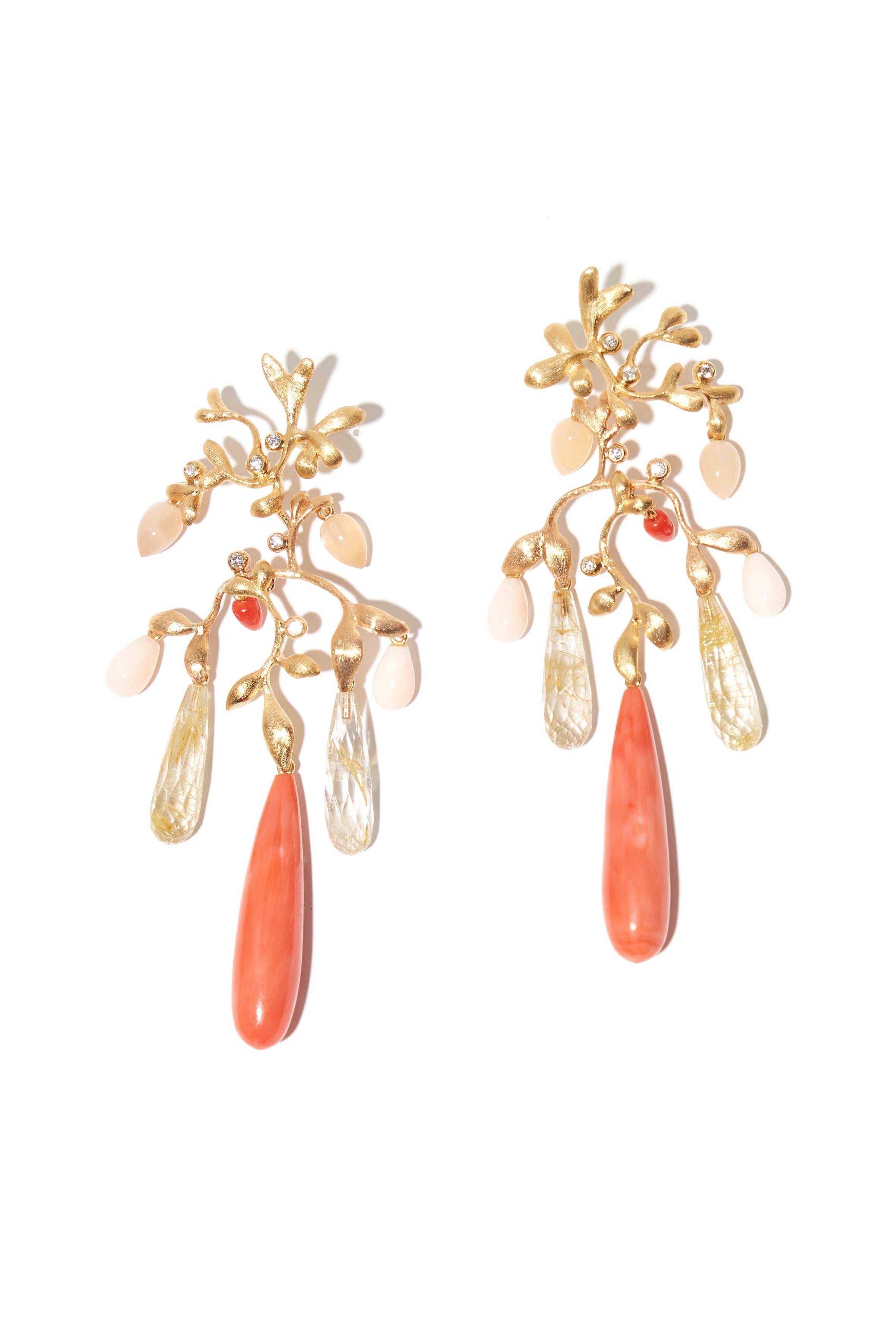 Festive Ole Lynggaard Chandelier arrings. With drops in a mesmerizing shade of beige-orange coral, alternated with rutile quartz drops and red coral drops. Shining diamonds to a total of 0.21 crts (TW/VS).

These earrings are a limited