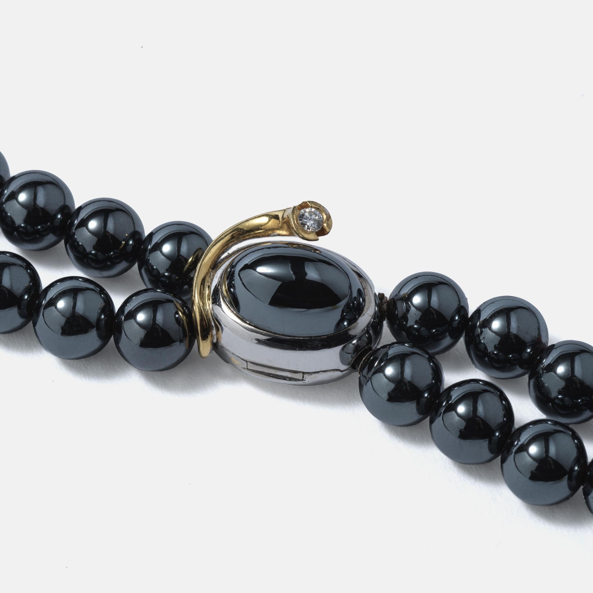 Brilliant Cut Ole Lynggaard necklace with hematite beads. Lock made of gold with a diamond. For Sale