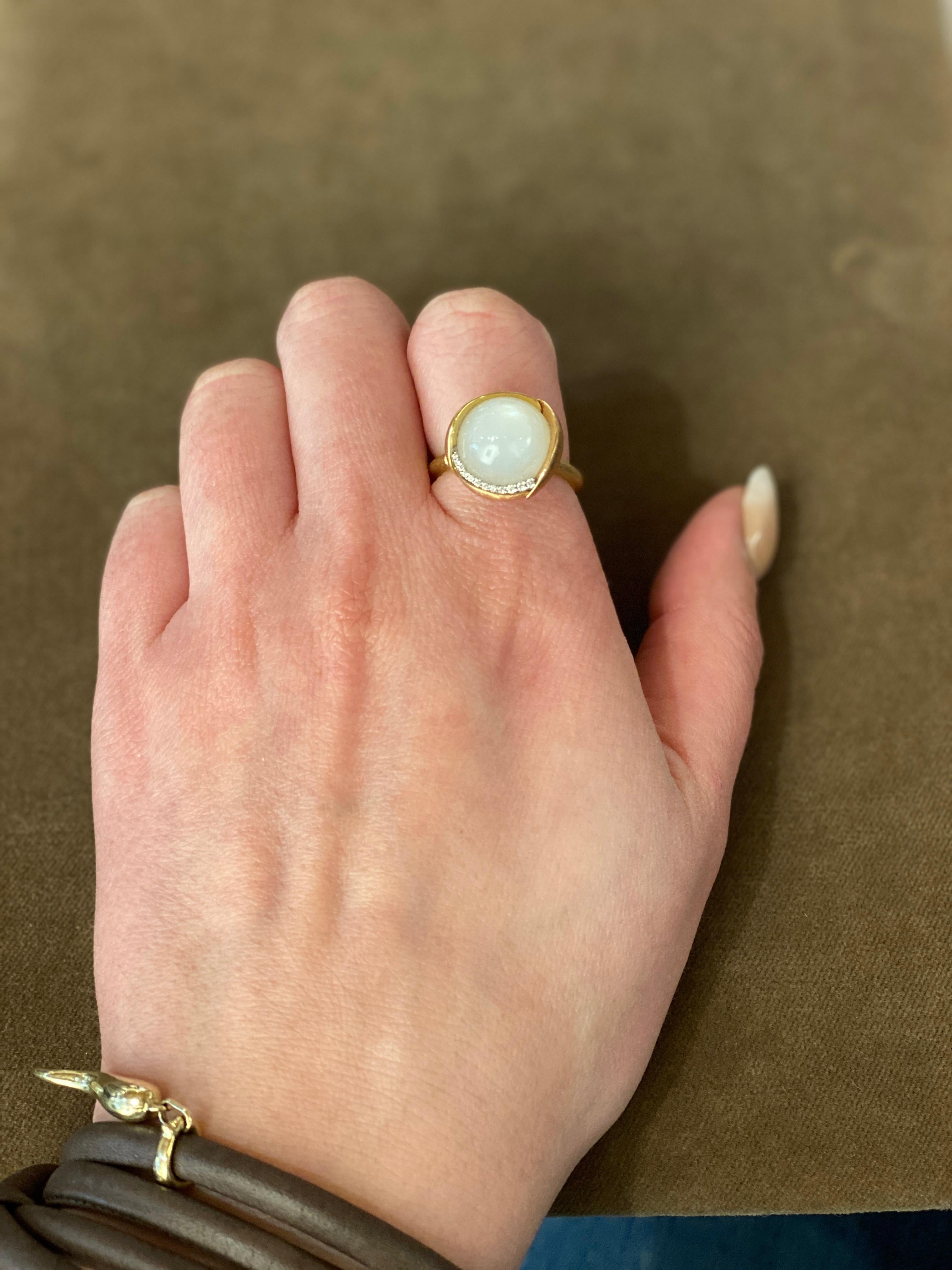 Exuding an inexplicable magical quality, Ole Lynggaard Copenhagen creates soft, organic designs inspiring women to express their enchanting, feminine side.

Embellished with pave white diamonds and delicate rose gold leaves, this white moonstone