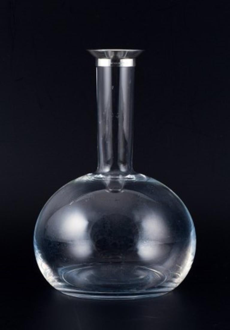 Danish Ole Palsby for Georg Jensen, wine decanter in clear glass and sterling silver. 