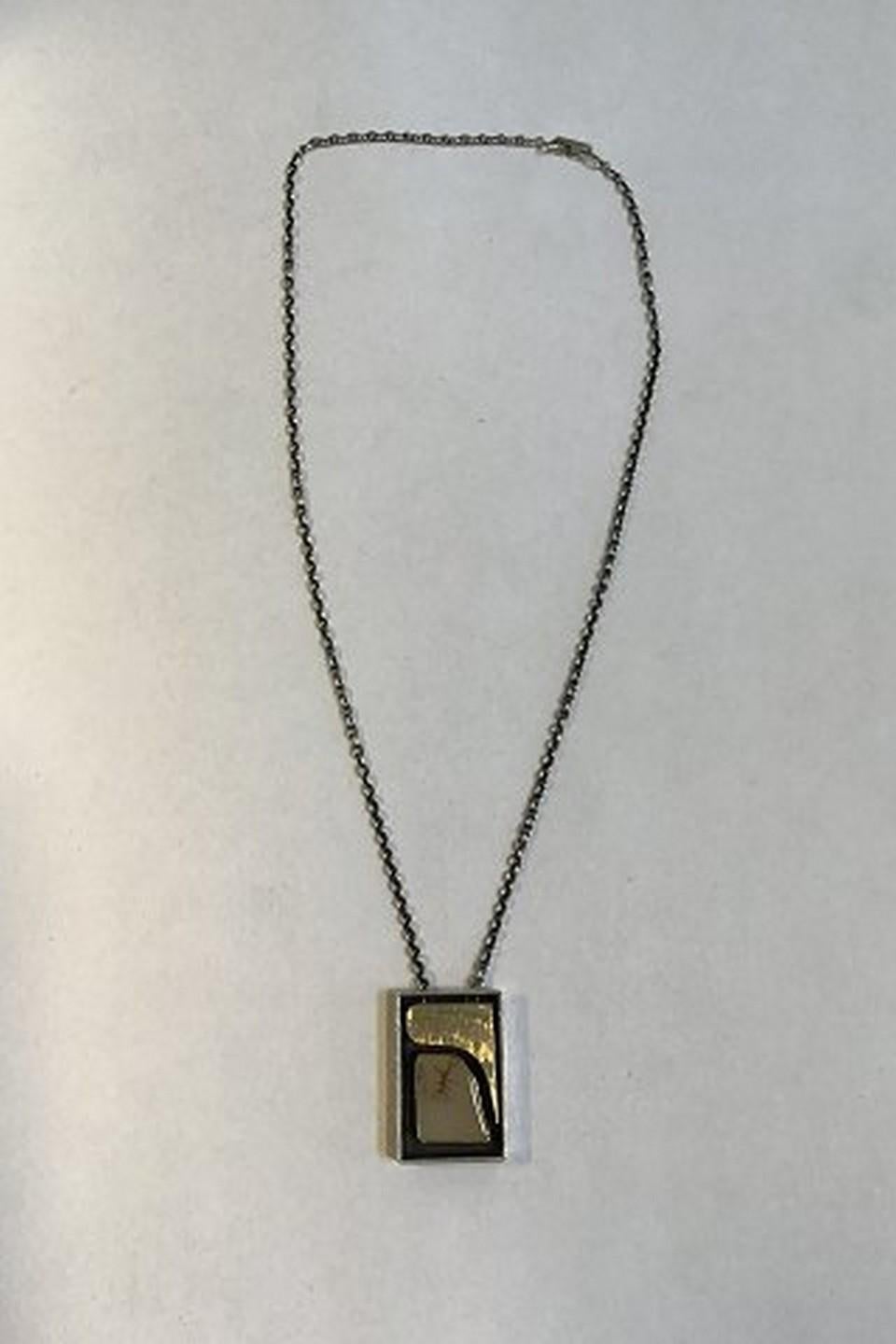 Ole Waldemar Jacobsen Sterling Silver Necklace/ Pendent with med gold decoration 

Measures 40 cm (15.74 in) 
Combined weight 17.9 gr /0.63 oz