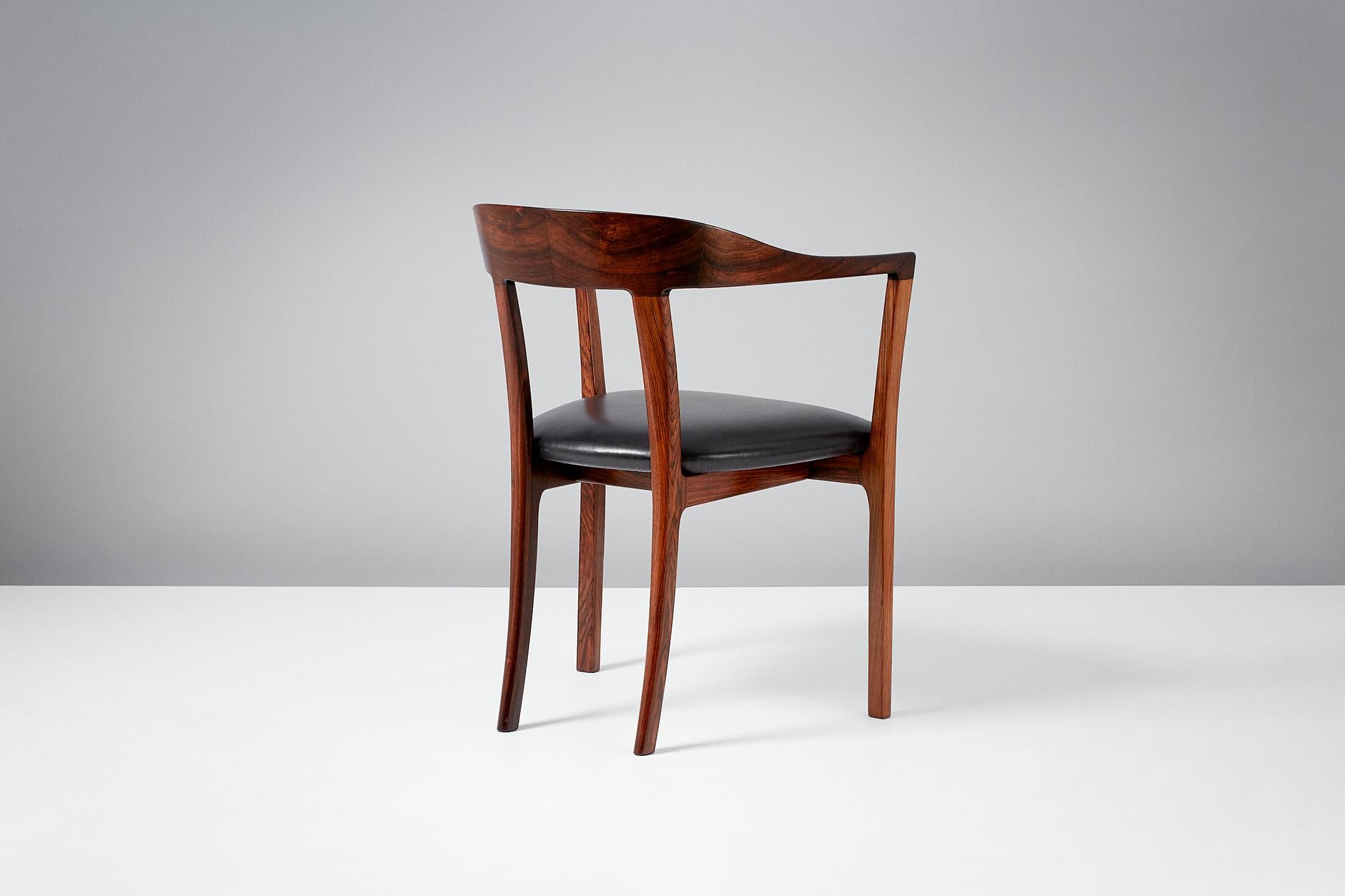 Ole Wanscher

J2883 armchair, 1958

Produced by master cabinetmaker A.J. Iversen in sumptuous Brazilian rosewood with aniline black leather seat. First presented at the Copenhagen Cabinetmakers' Guild in 1958. A rarely seen and highly
