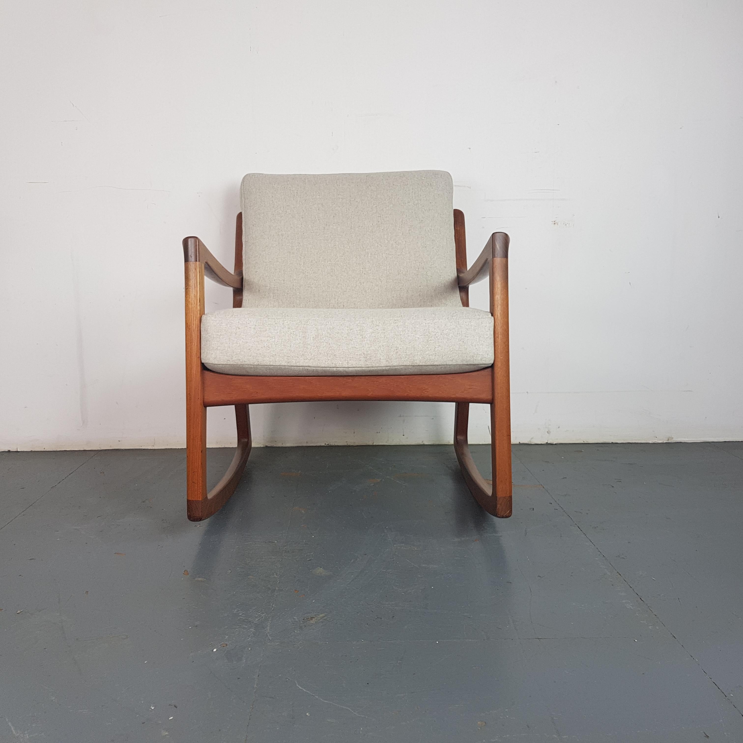 1960s solid teak rocking chair designed by Ole Wanscher for France & Son, Denmark. With original spring loaded cushions reupholstered in a Abraham Moon grey upholstery.

Approximate dimensions:

Height 78 cm

Width 68 cm

Depth 72 cm

Seat
