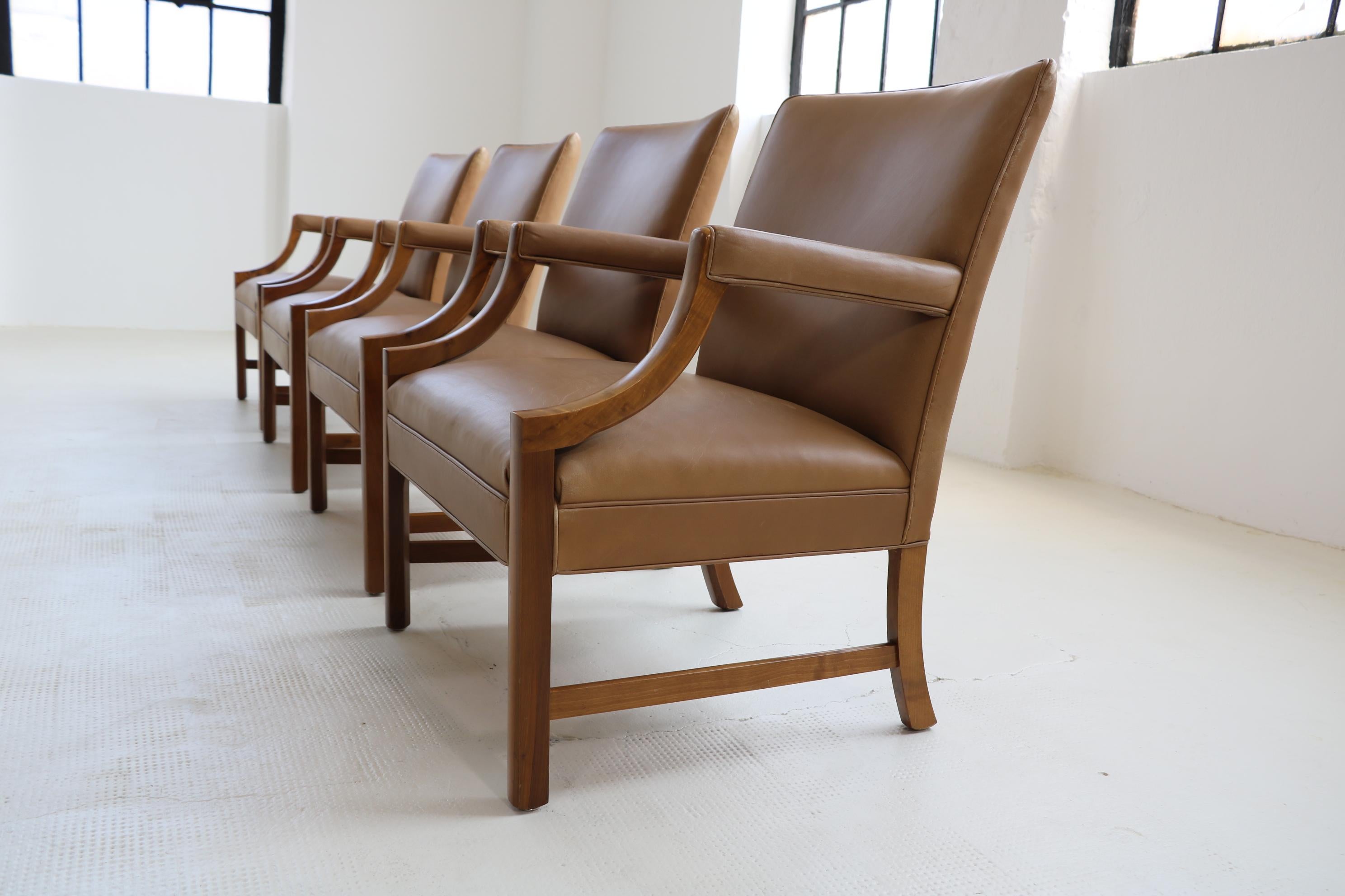 2 Easy chairs by the famous, danish architect and designer Ole Wanscher for A.J. Iversen in the 50s.
We consider the armchairs to be special and extraordinary and in the finish, 
Walnut frame in combination with natural coloured leather, amazing