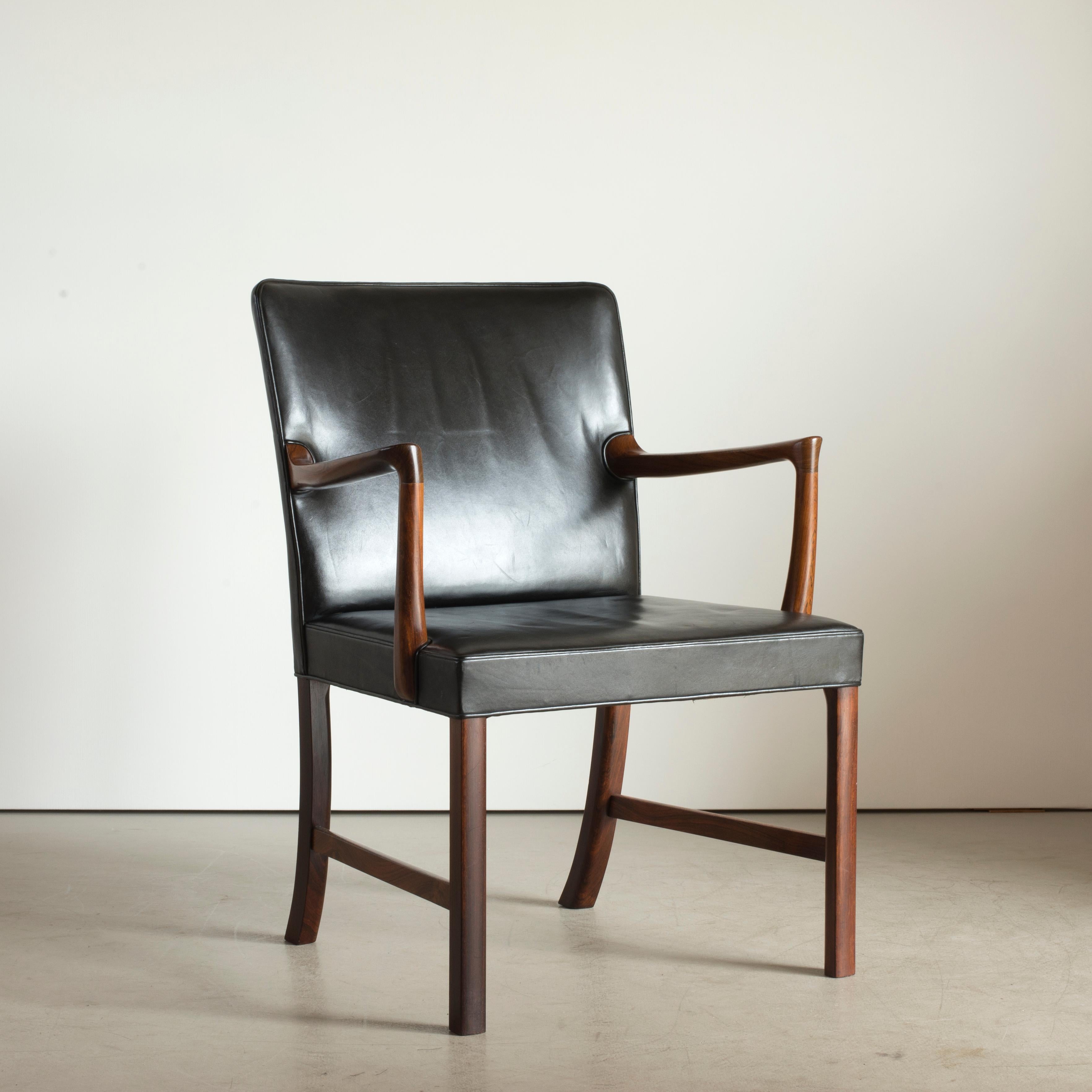 Ole Wanscher armchair of Brazilian rosewood, seat and back upholstered with black leather. Executed by A.J. Iversen, Copenhagen.