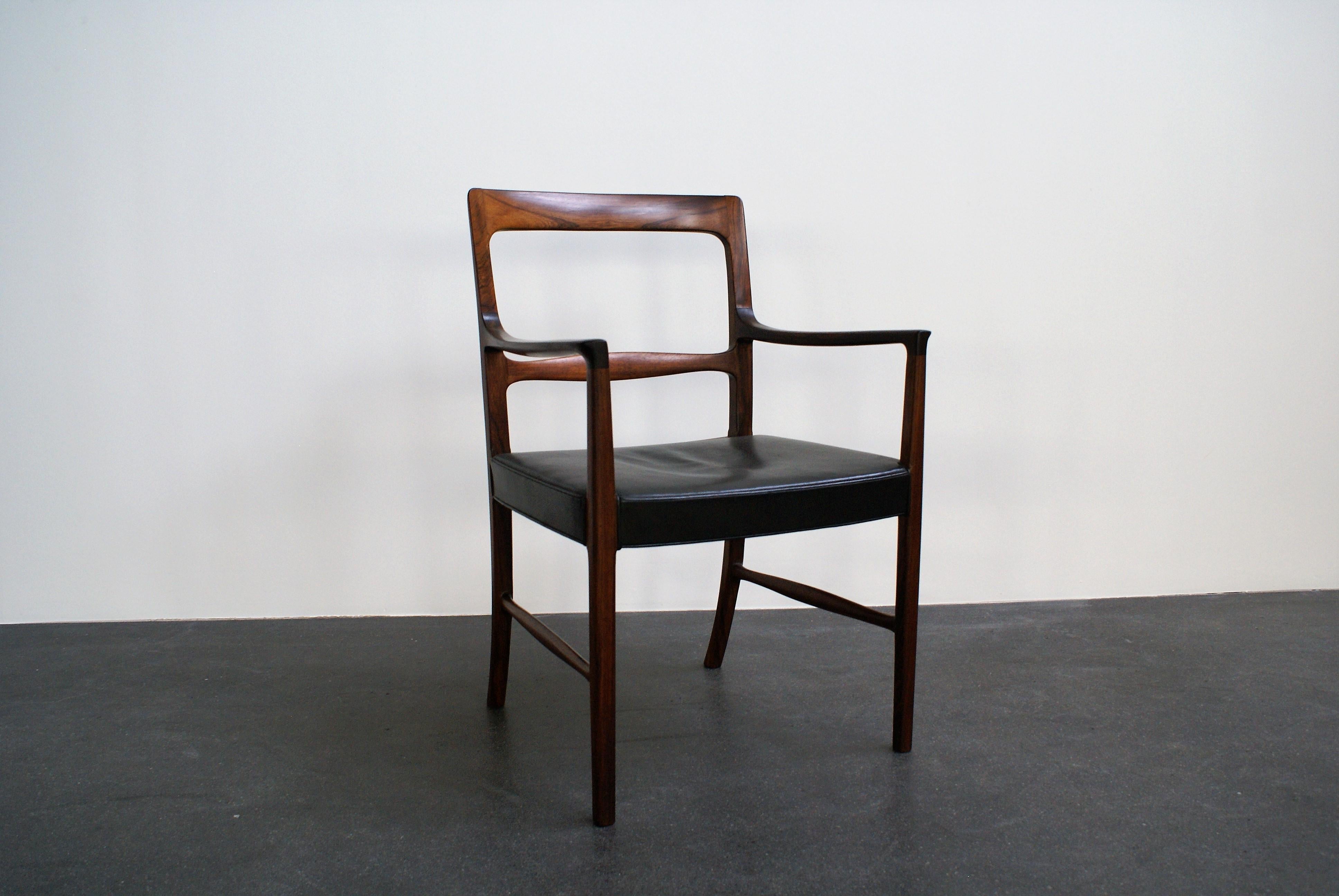 Armchair in Brazilian rosewood and original black leather designed by Ole Wanscher in 1954. The chair is executed by master cabinetmaker A. J. Iversen, Copenhagen.

The chair was exhibited at the 'Copenhagen Cabinetmakers’ Guild' exhibition in