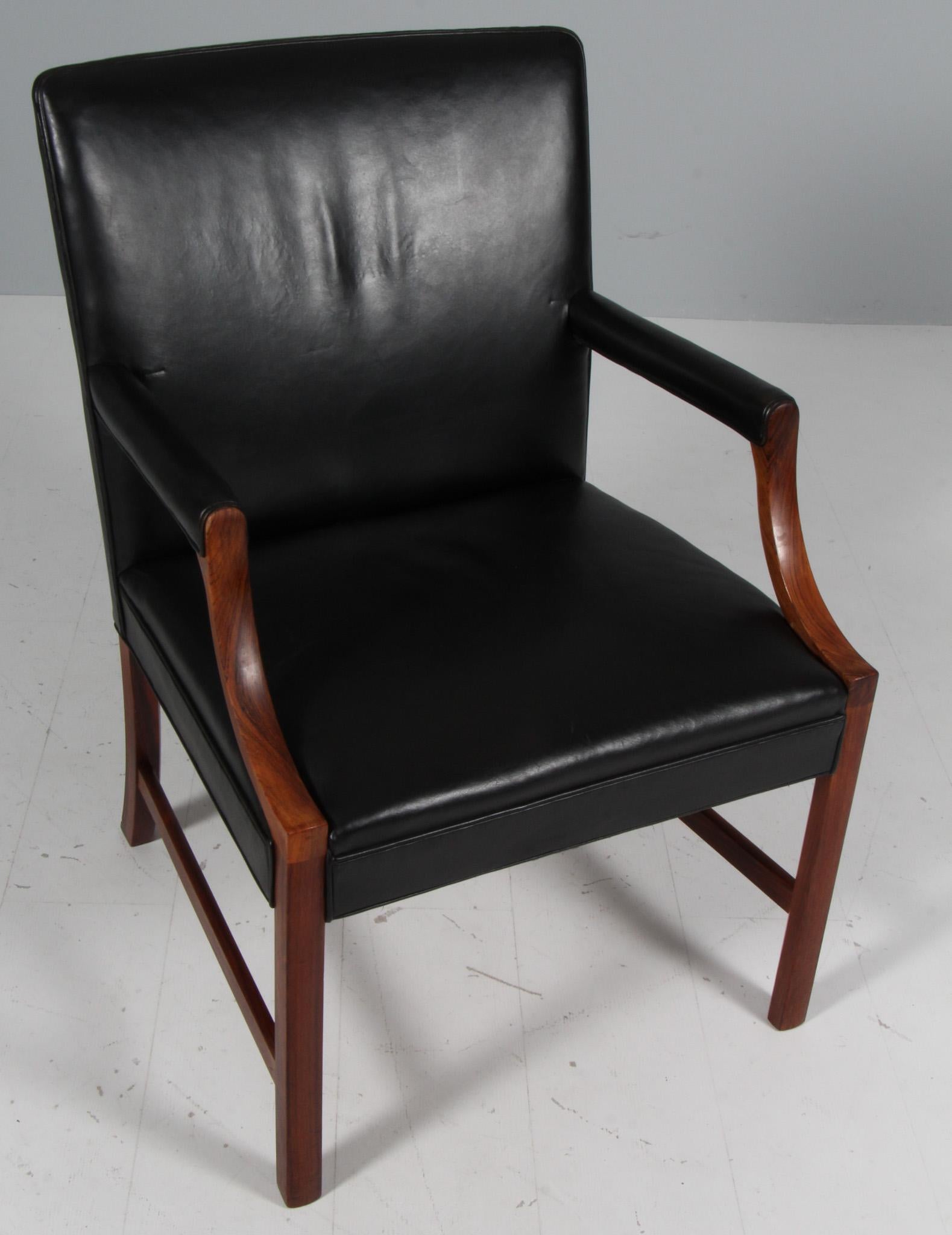 Ole Wanscher armchair of black leather and rosewood frame

Made by Arne Wahl Iversen.