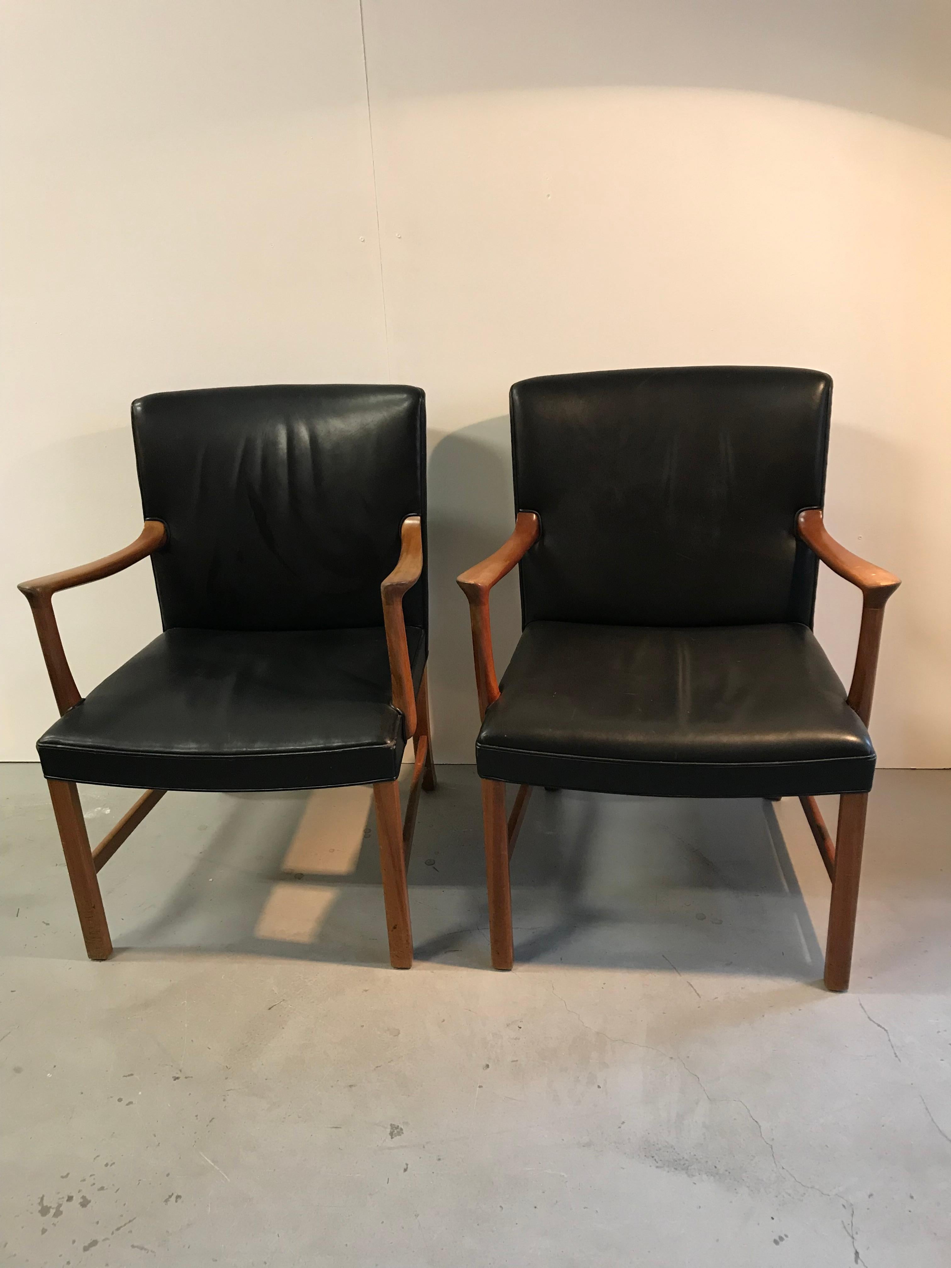 Set of two very comfortable armchairs designed by Ole Wanscher in the 1950s for A.J.Iversen Denmark.
Wooden frame with black leather seating.