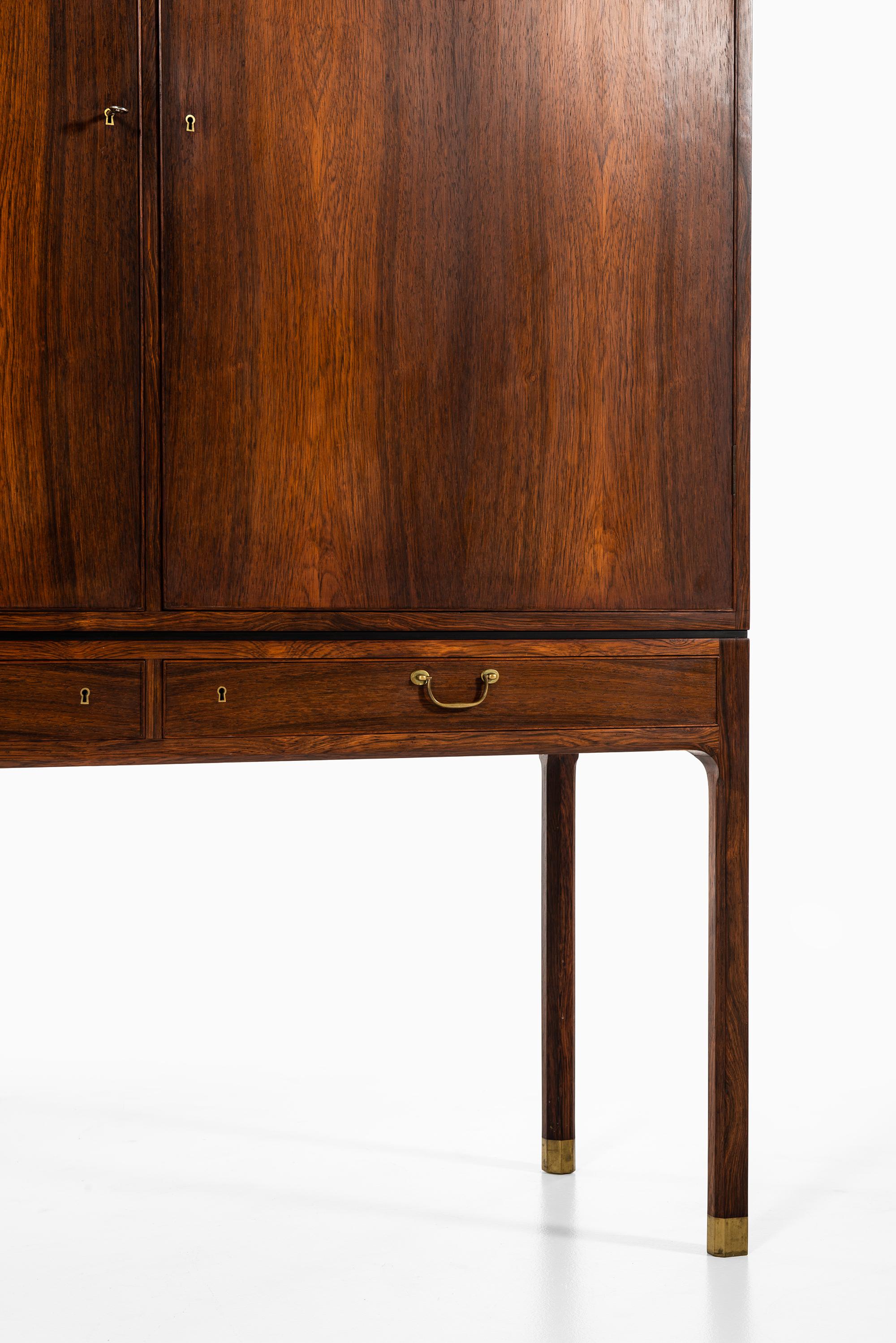Very rare cabinet in rosewood and brass designed by Ole Wanscher. Produced by cabinetmaker A.J Iversen in Denmark.