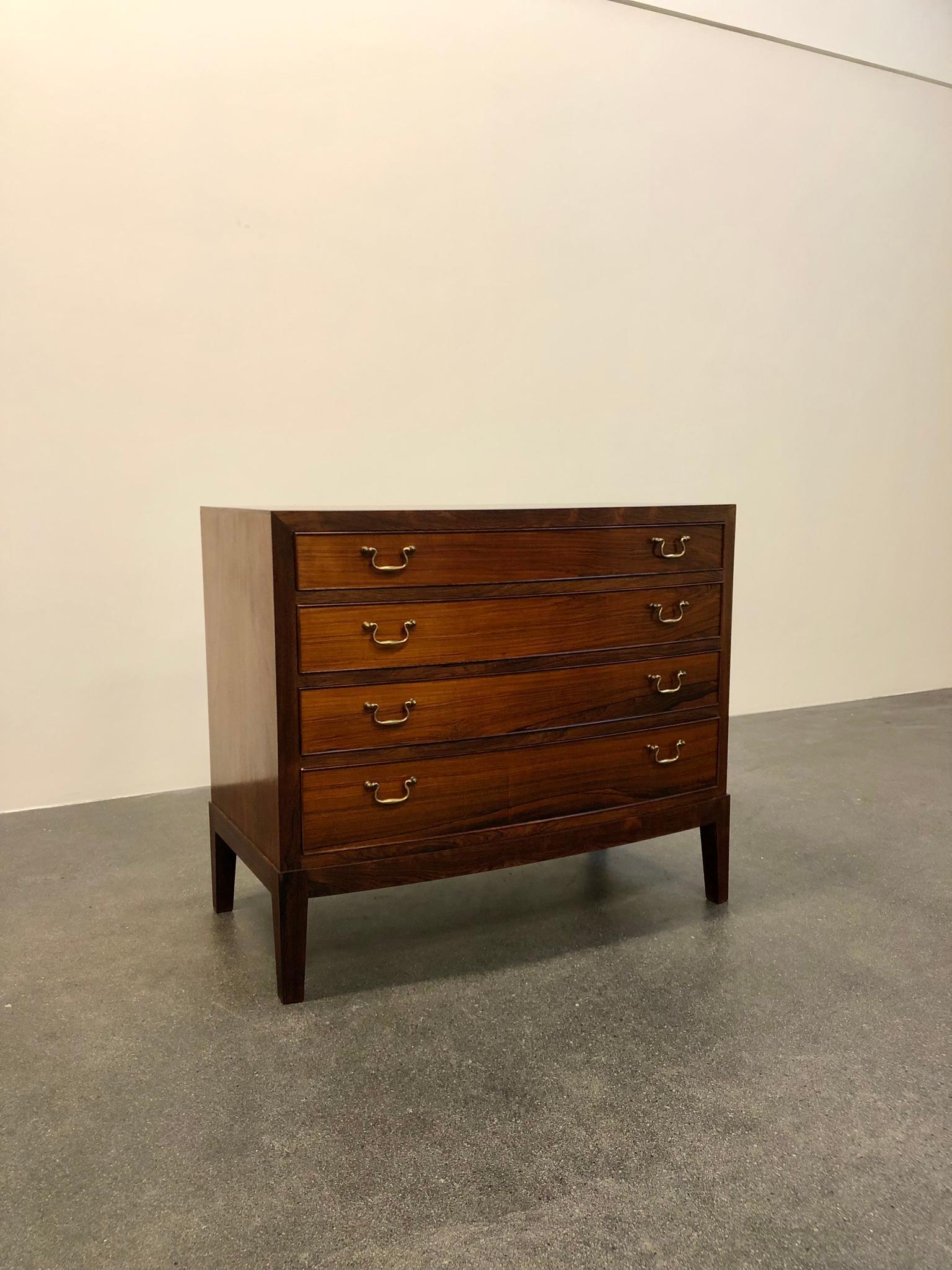 Ole Wanscher chest of drawers in rosewood with bass fittings. Made by master cabinetmaker A. J. Iversen. Chest has four drawers.