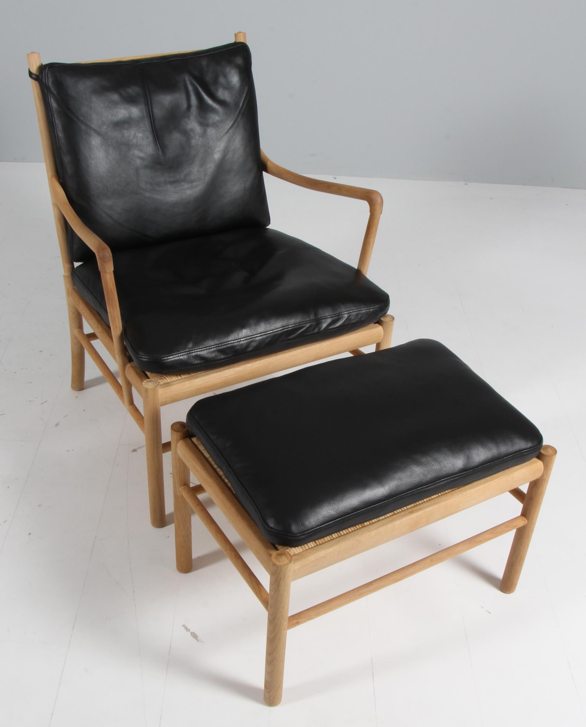 Ole Wanscher lounge chair and ottoman original upholstered with premium aniline leather.

Made in oak. 

Model OW 149 colonial chair, made by Carl Hansen & Søn.
