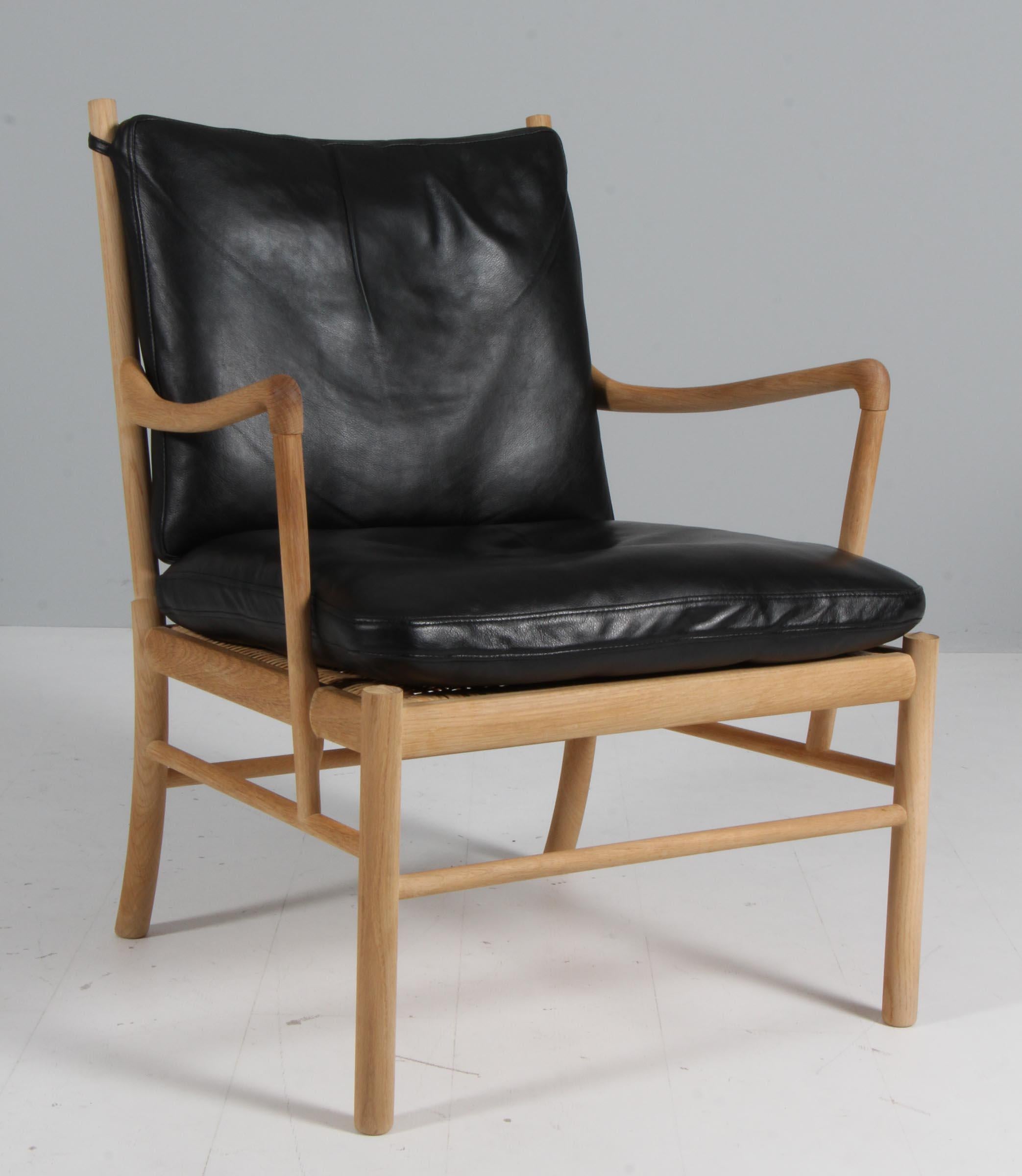 Mid-20th Century Ole Wanscher Colonial Chair and Ottoman in oak, OW149 For Sale