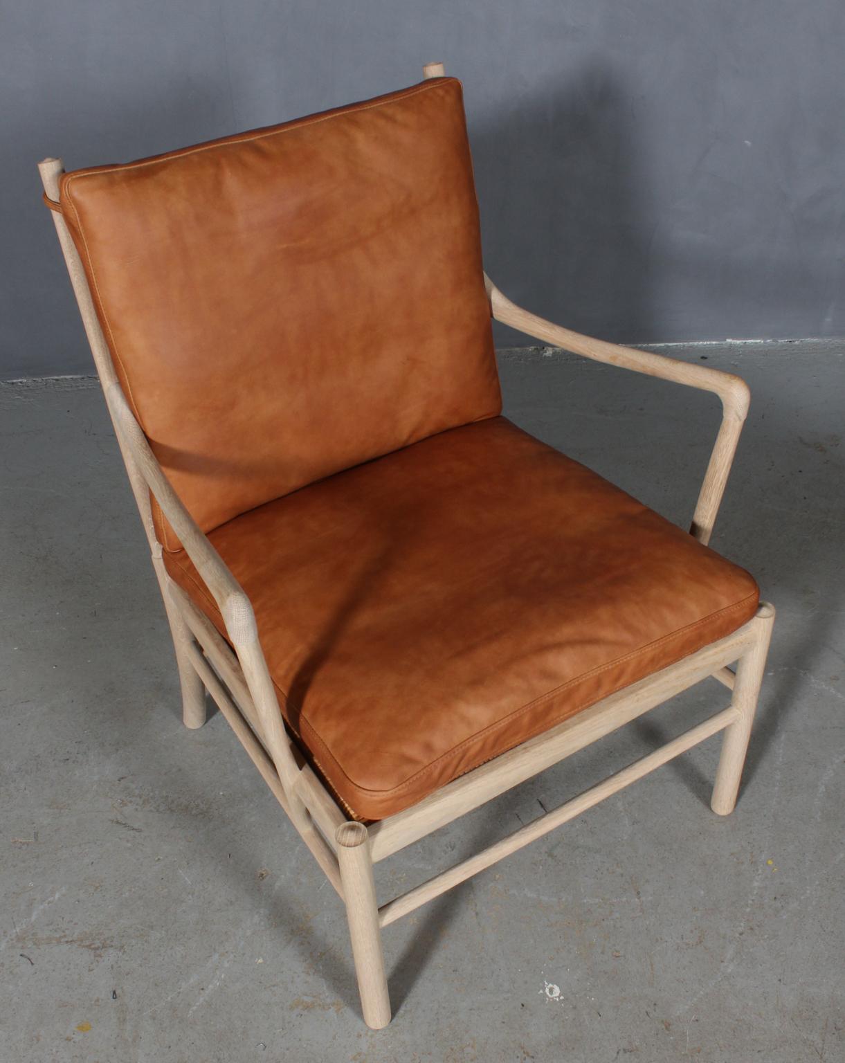 Ole Wanscher lounge chair new upholstered with cognac vintage aniline leather.

Made in soap treated oak. 

Model colonial chair, made by Carl Hansen.