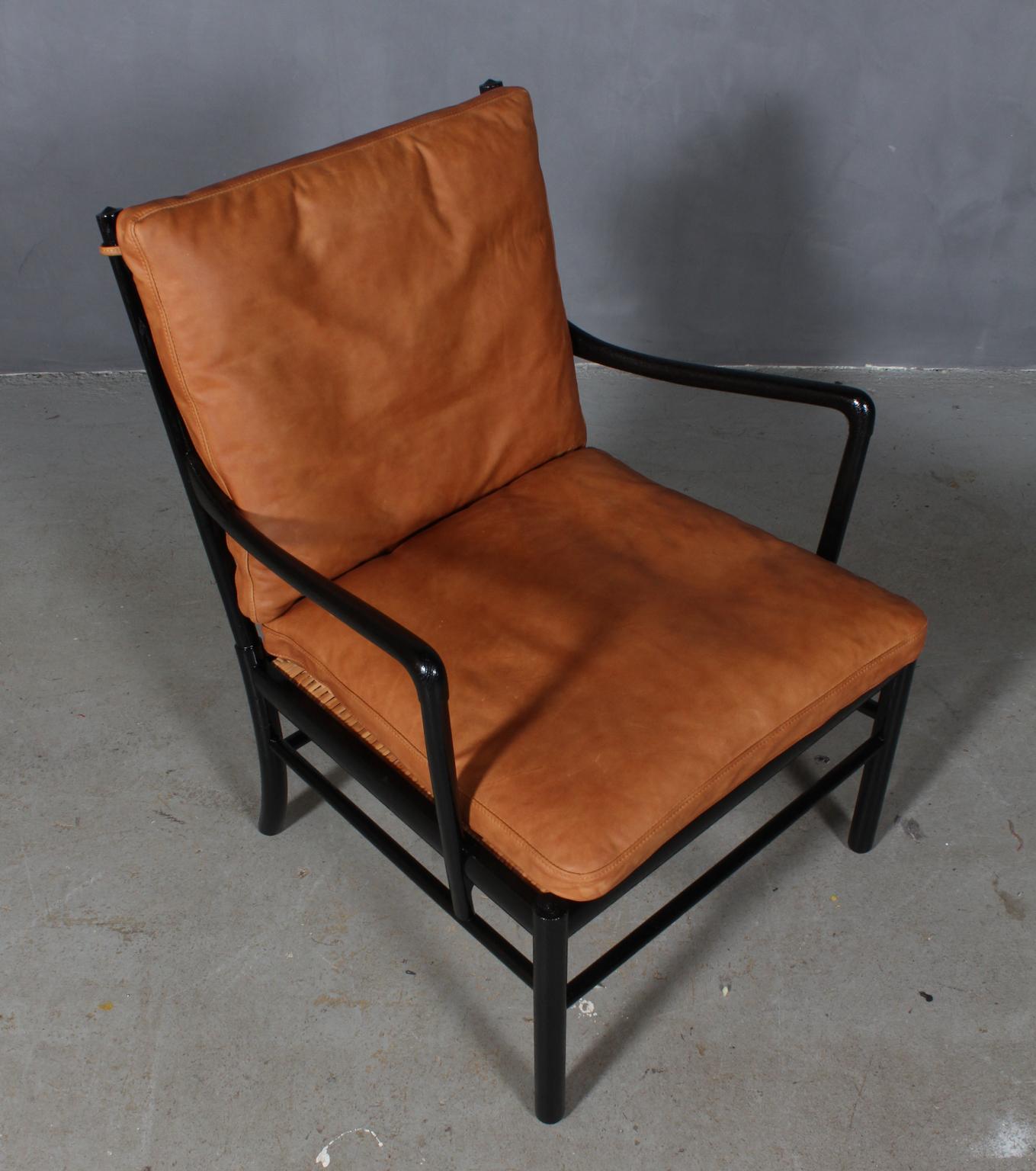 Ole Wanscher lounge chair new upholstered with cognac vintage aniline leather.

Made in new black laquered oak. 

Model colonial chair, made by Poul Jeppesen.