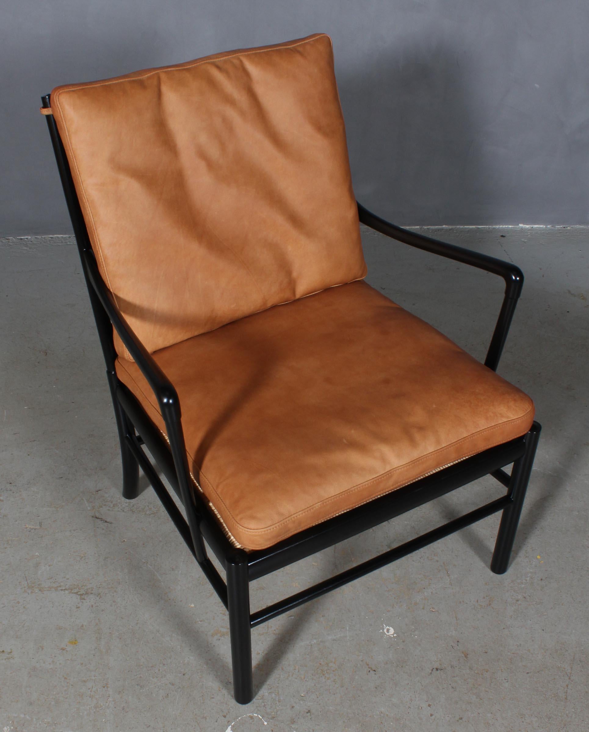 Ole Wanscher lounge chair new upholstered with cognac vintage aniline leather.

Made in new black laquered mahogany. 

Model colonial chair, made by Poul Jeppesen.