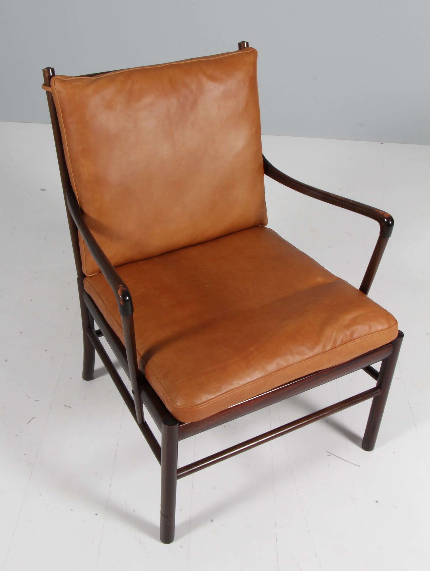 Ole Wanscher lounge chair new upholstered with cognac vintage aniline leather.

Made in laquered mahogany. 

Model colonial chair, made by Poul Jeppesen.