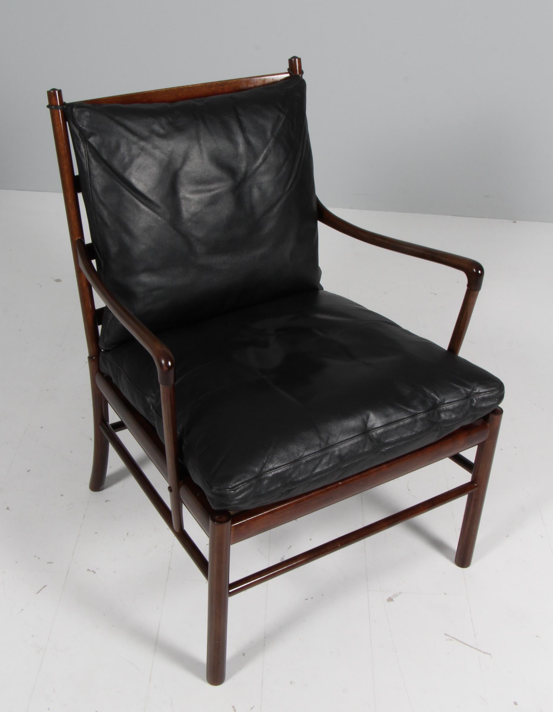 Ole Wanscher lounge chair original upholstered with black aniline leather.

Made in laquered mahogany. 

Model colonial chair, made by Poul Jeppesen.