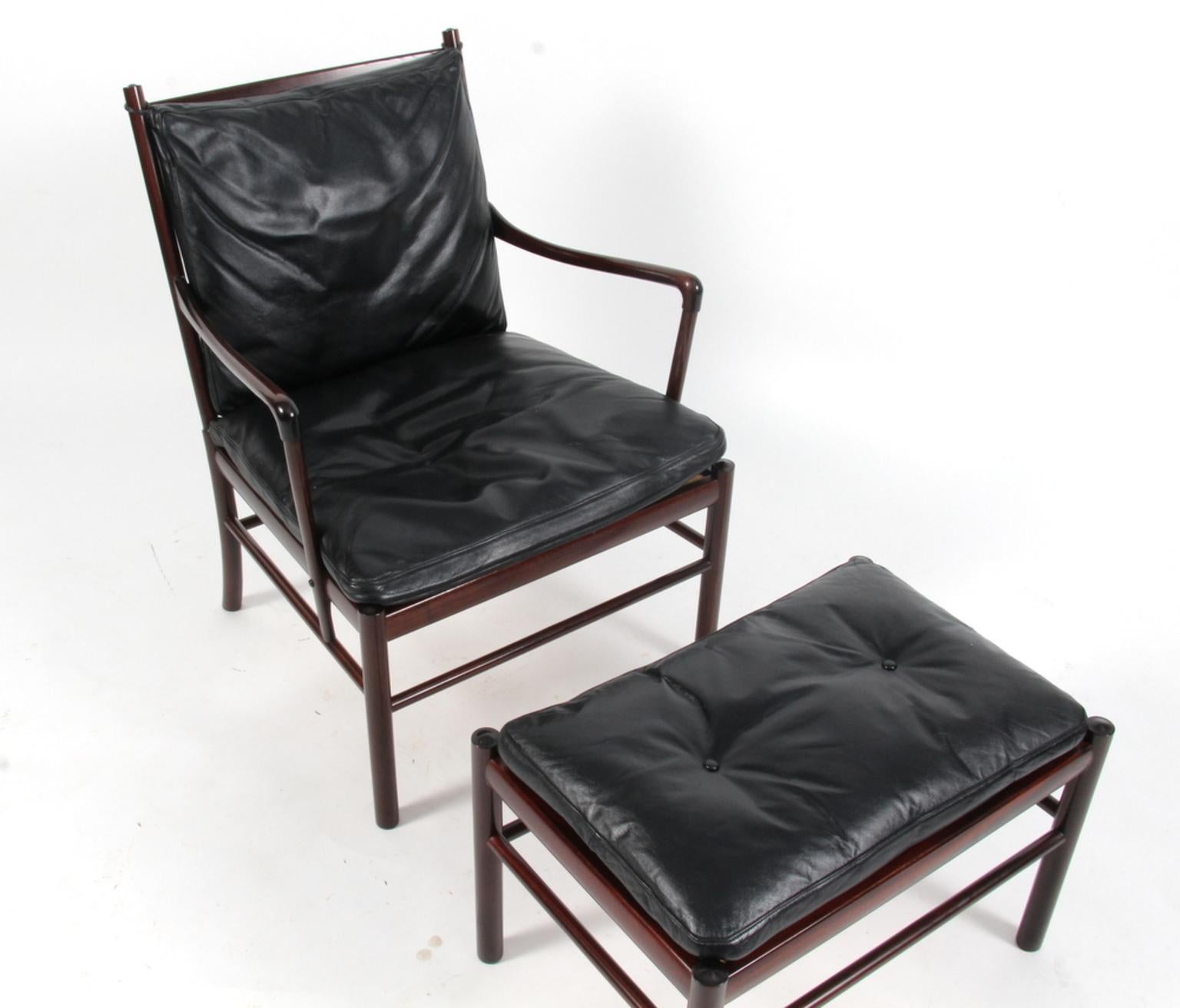 Ole Wanscher lounge chair and ottoman original upholstered with black leather.

Made in mahogany. 

Model PJ 149 colonial chair, made by Poul Jeppesen.