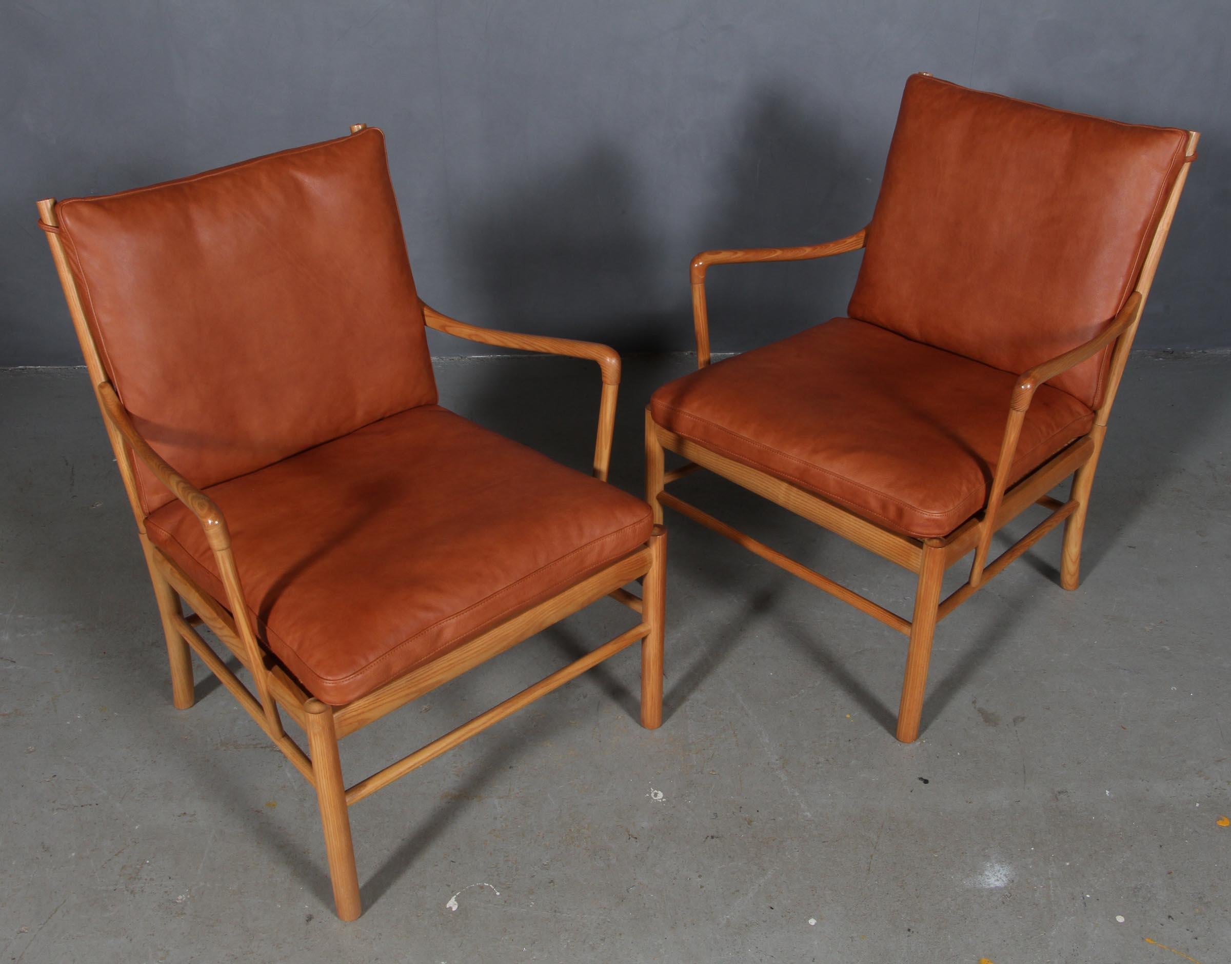 Ole Wanscher lounge chairs new upholstered with cognac aniline leather.

Made in ash.

Model PJ149 colonial chair, made by Poul jeppesen.