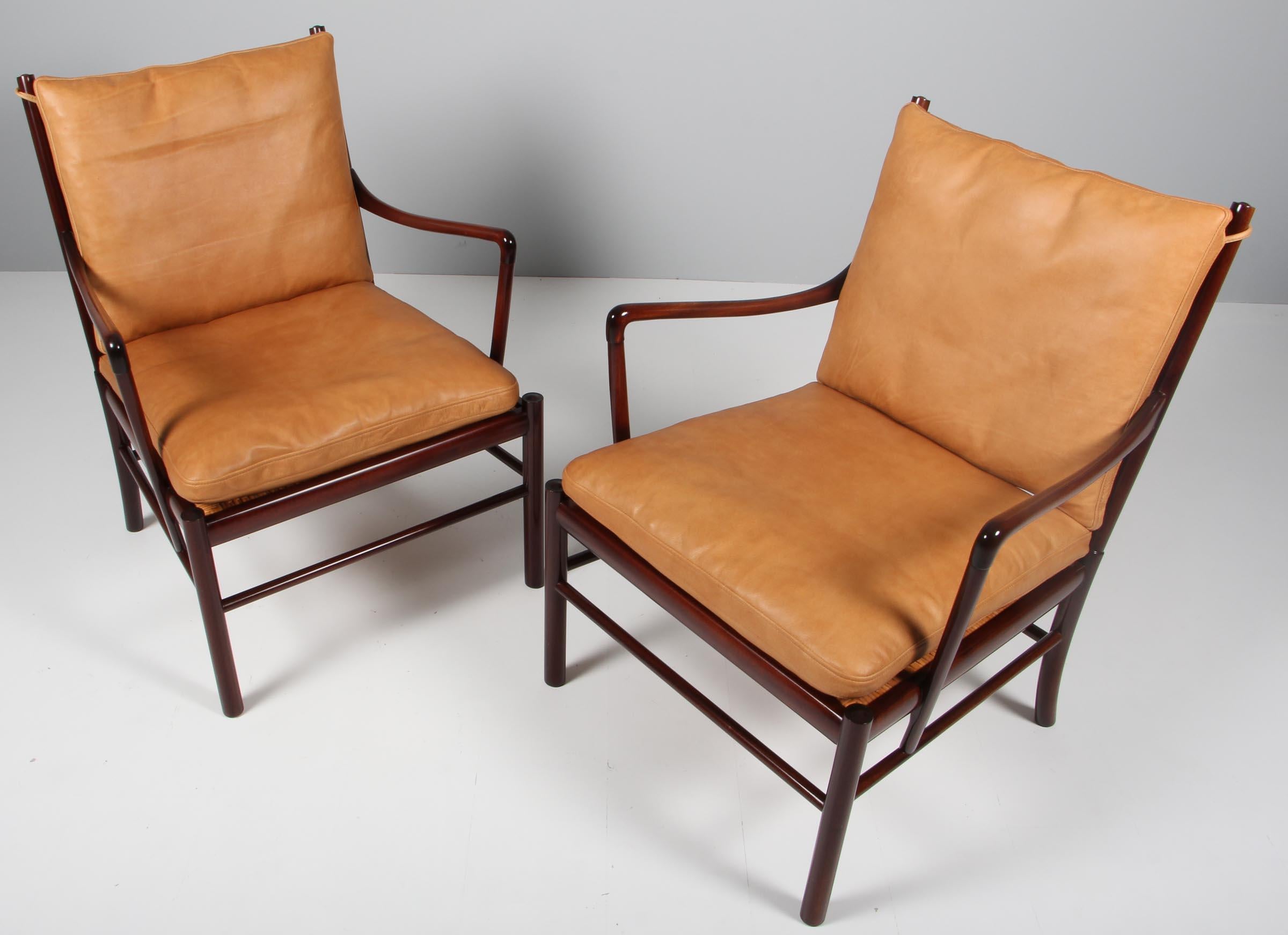 Ole Wanscher lounge chairs new upholstered with cognac aniline leather.

Made in mahogany.

Model PJ149 colonial chair, made by Poul jeppesen.
