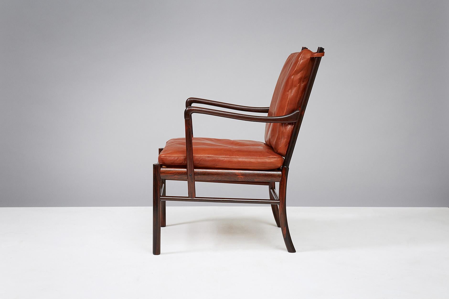 Ole Wanscher

PJ-149 Colonial chairs, 1949.

These examples made from Brazilian rosewood with woven rattan cane seats. Produced by Poul Jeppesen, Denmark, circa 1950s. Cognac brown aniline leather seat cushions with loose feather filling.