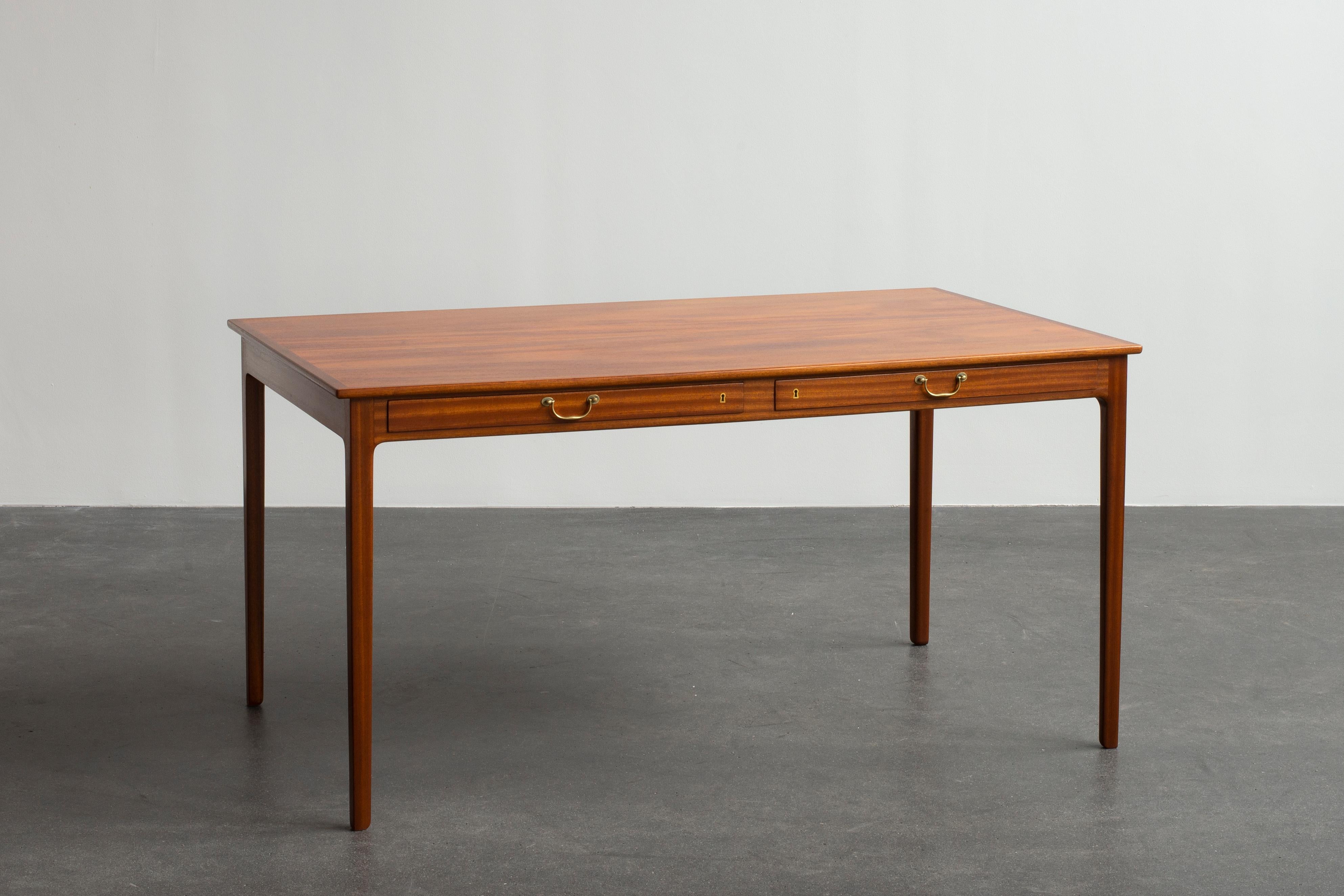 Ole Wanscher desk in mahogany with two drawers. Executed by A. J. Iversen, Copenhagen, Denmark.