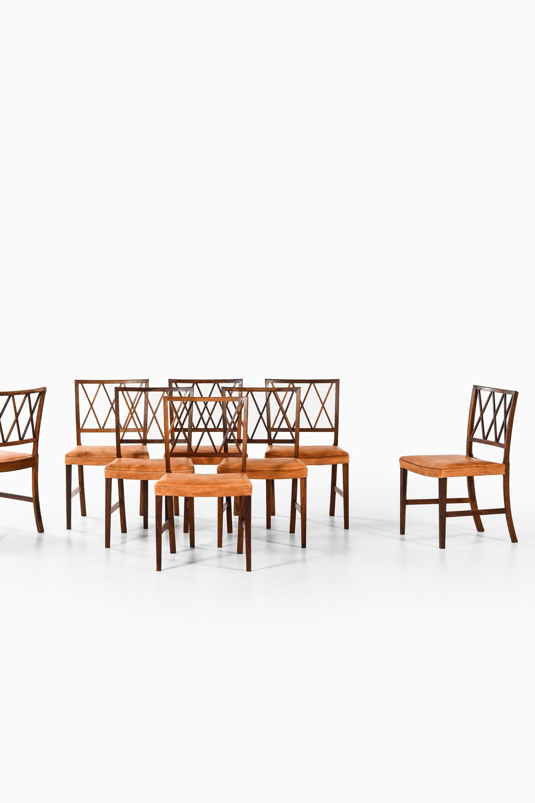 Rare set of 8 dining chairs designed by Ole Wanscher. Produced by cabinetmaker A.J. Iversen in Denmark.