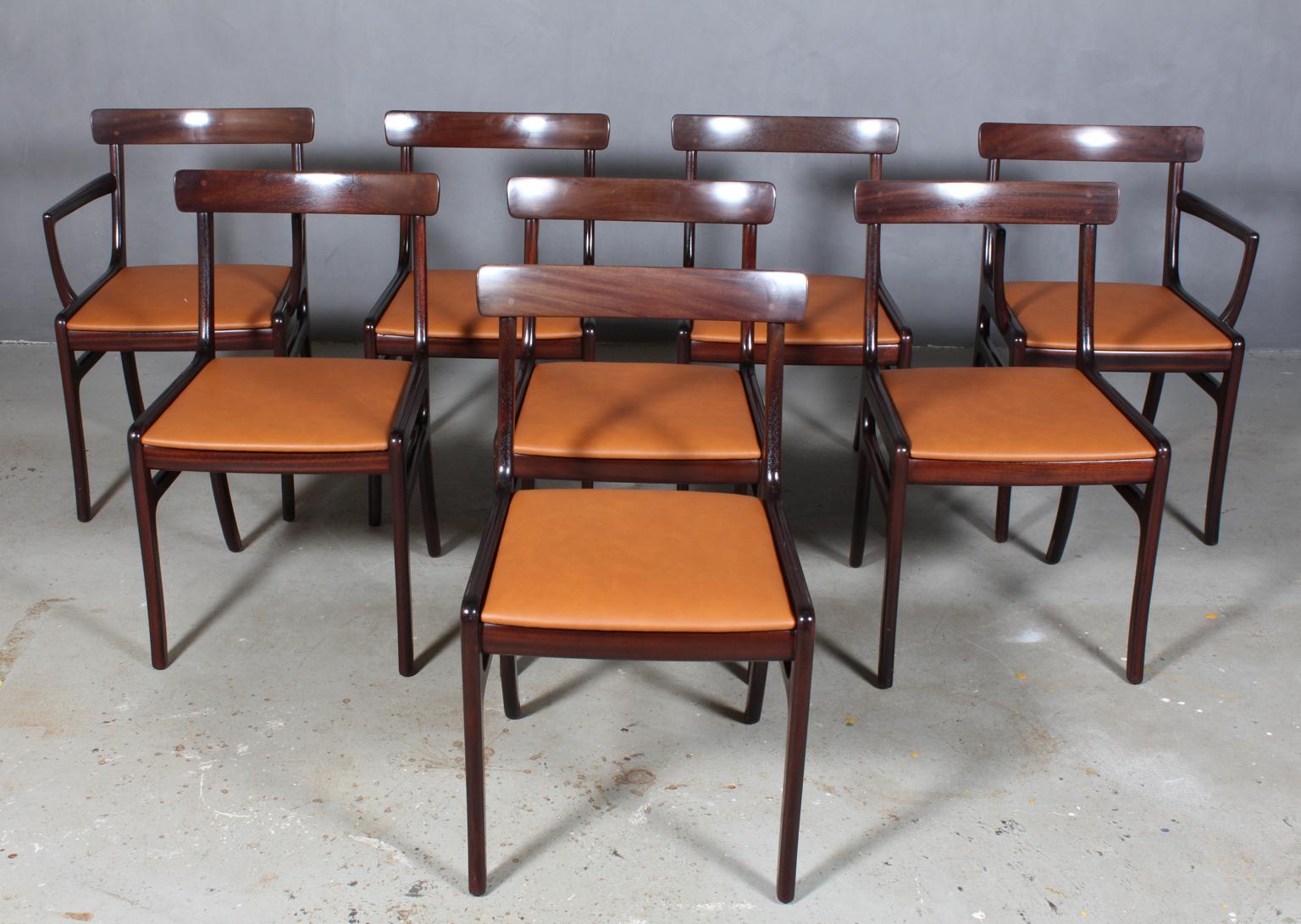 Ole Wanscher dining chairs, two armchairs, new upholstered in semi aniline leather. 

Made of massive mahogany.

Model Rungstedlund, made by Poul Jeppesen.

 