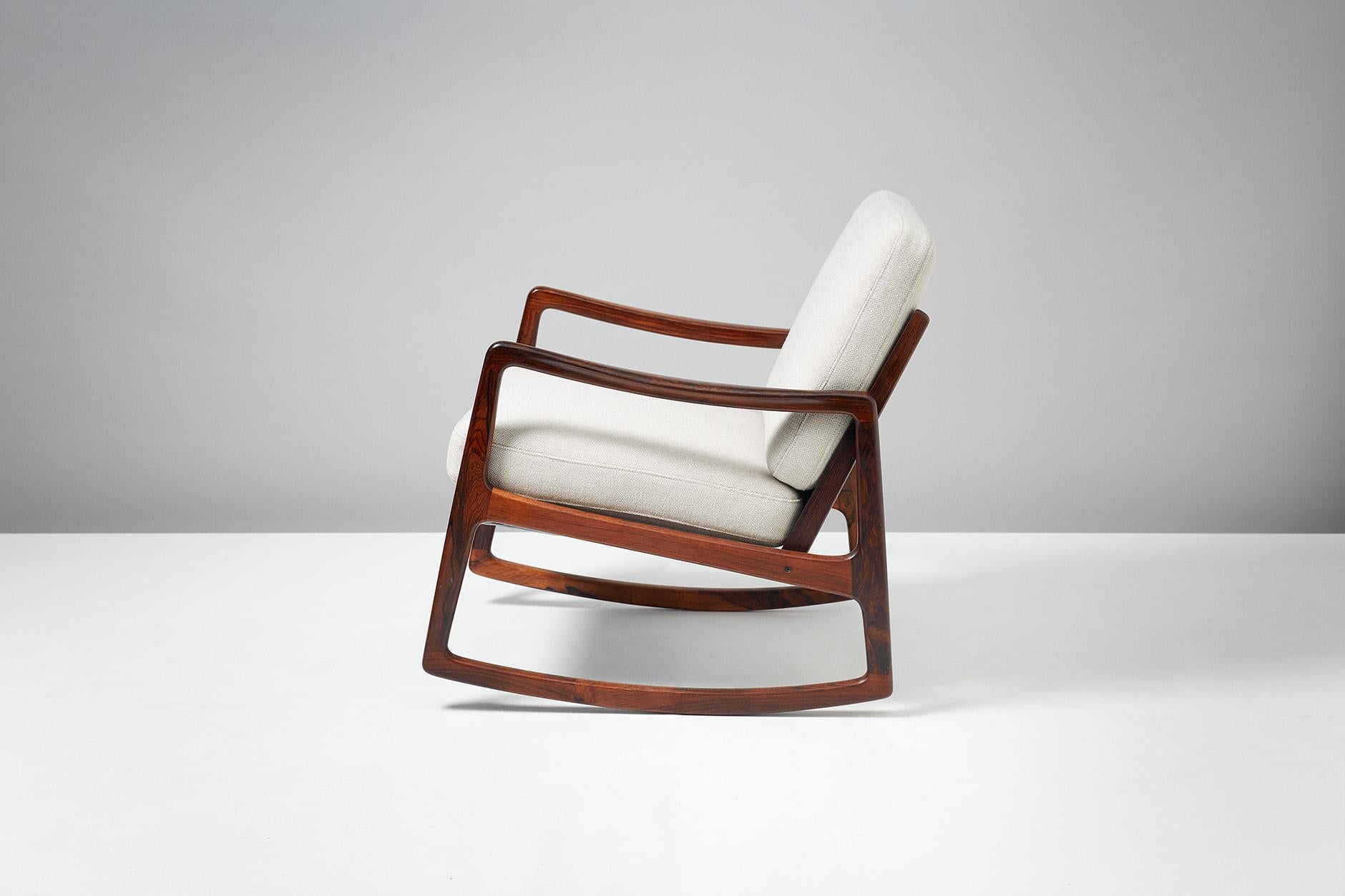 Rare rosewood edition of the model FD-120 rocking chair, produced by France and Son, Denmark, circa 1960. Solid Brazilian rosewood frame with maker's badge to inside of back of seat. The original sprung cushions have been re-covered in Kvadrat wool