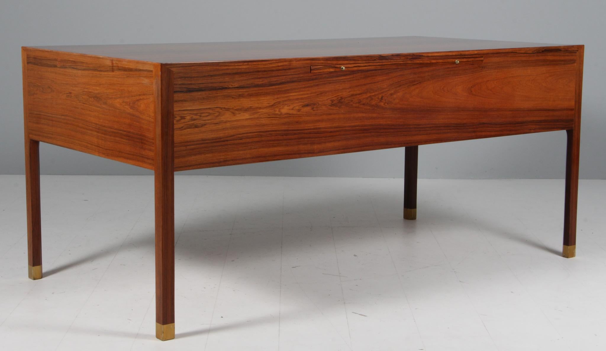 Ole Wanscher for A. J. Iversen writing desk in rosewood. With handles and legs in brass.

Made by A. J. Iversen in the 1950s