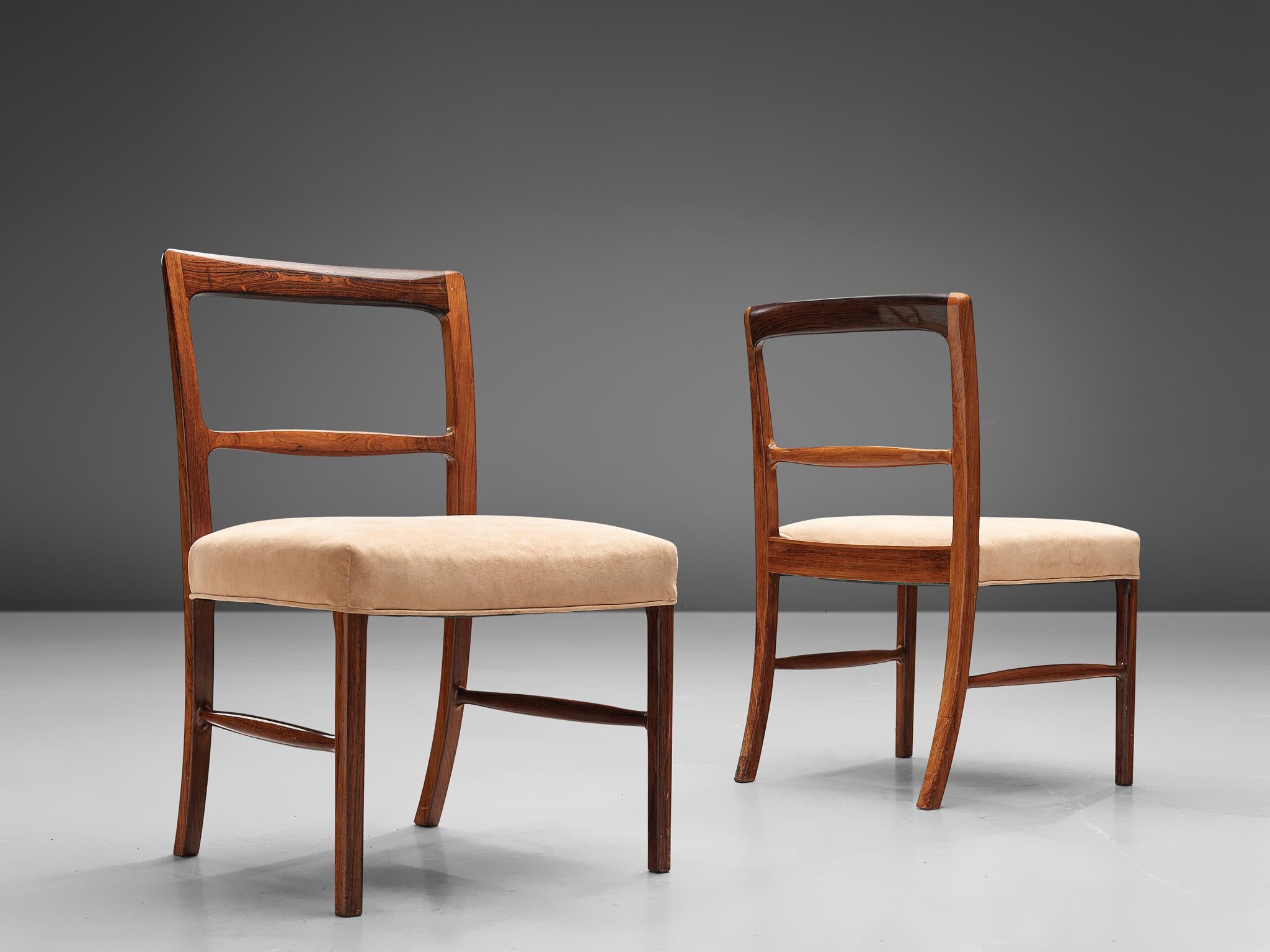 Ole Wanscher for AJ Iversen, set of eight dining chairs, rosewood and beige upholstery, Denmark, 1963.

A luxurious dining set in rosewood, consisting of six dining chairs and two armchairs. The 'Forum' model shows the high level of craftsmanship