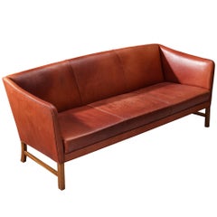 Ole Wanscher für A.J. Iverseren-Sofa aus rotem, patiniertem Leder und Mahagoni