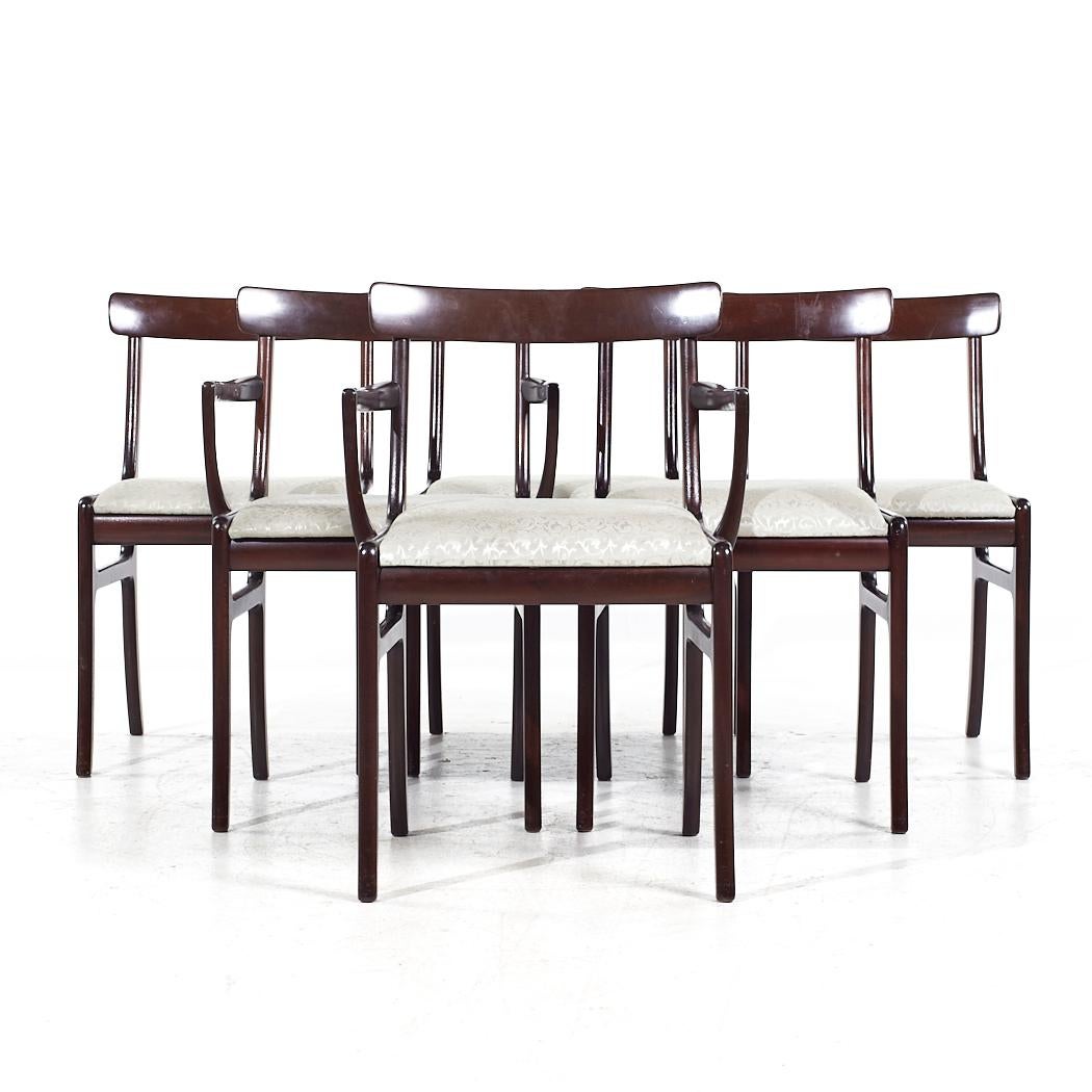 Ole Wanscher for PJ Furniture Mid Century Danish Rosewood Dining Chairs - Set of 6

Each armless chair measures: 18.5 wide x 20 deep x 30.5 high, with a seat height of 19 inches
Each captains chair measures: 20.75 wide x 20 deep x 30.5 high, with a