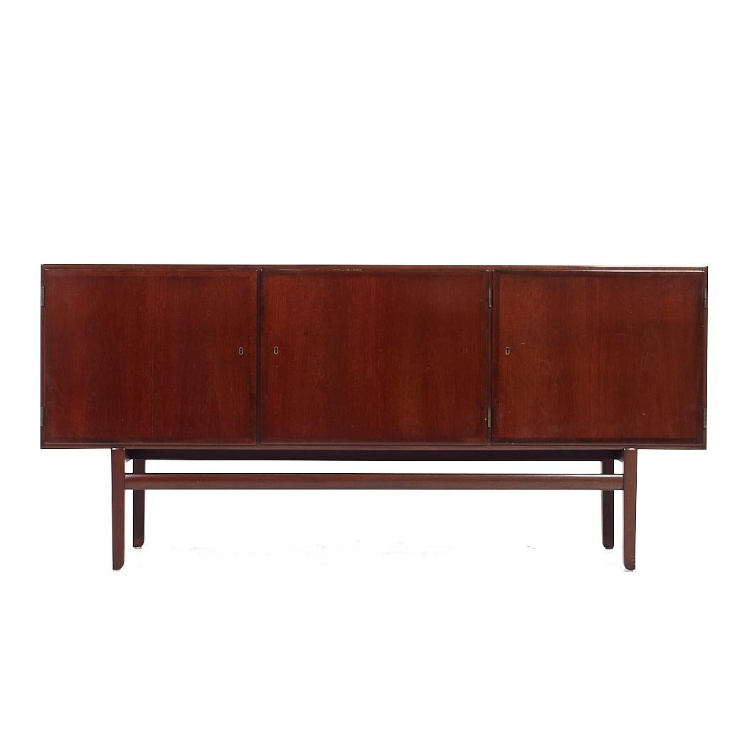 Ole Wanscher for PJ Furniture Mid Century Danish Rosewood Credenza

This credenza measures: 71 wide x 19.25 deep x 32.75 inches high

All pieces of furniture can be had in what we call restored vintage condition. That means the piece is restored