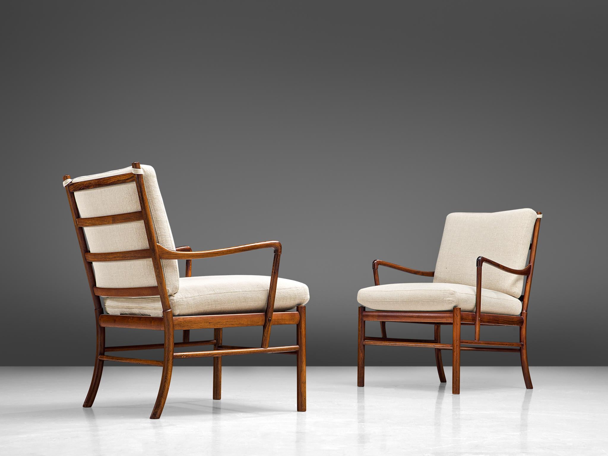 Ole Wanscher for Poul Jeppesen, pair of 'Colonial' armchairs, rosewood, cane and fabric, Denmark, 1949

Elegant pair easy chairs with a slim, rosewood frame by the Danish designer Ole Wanscher. These chairs show the great craftsmanship and attention