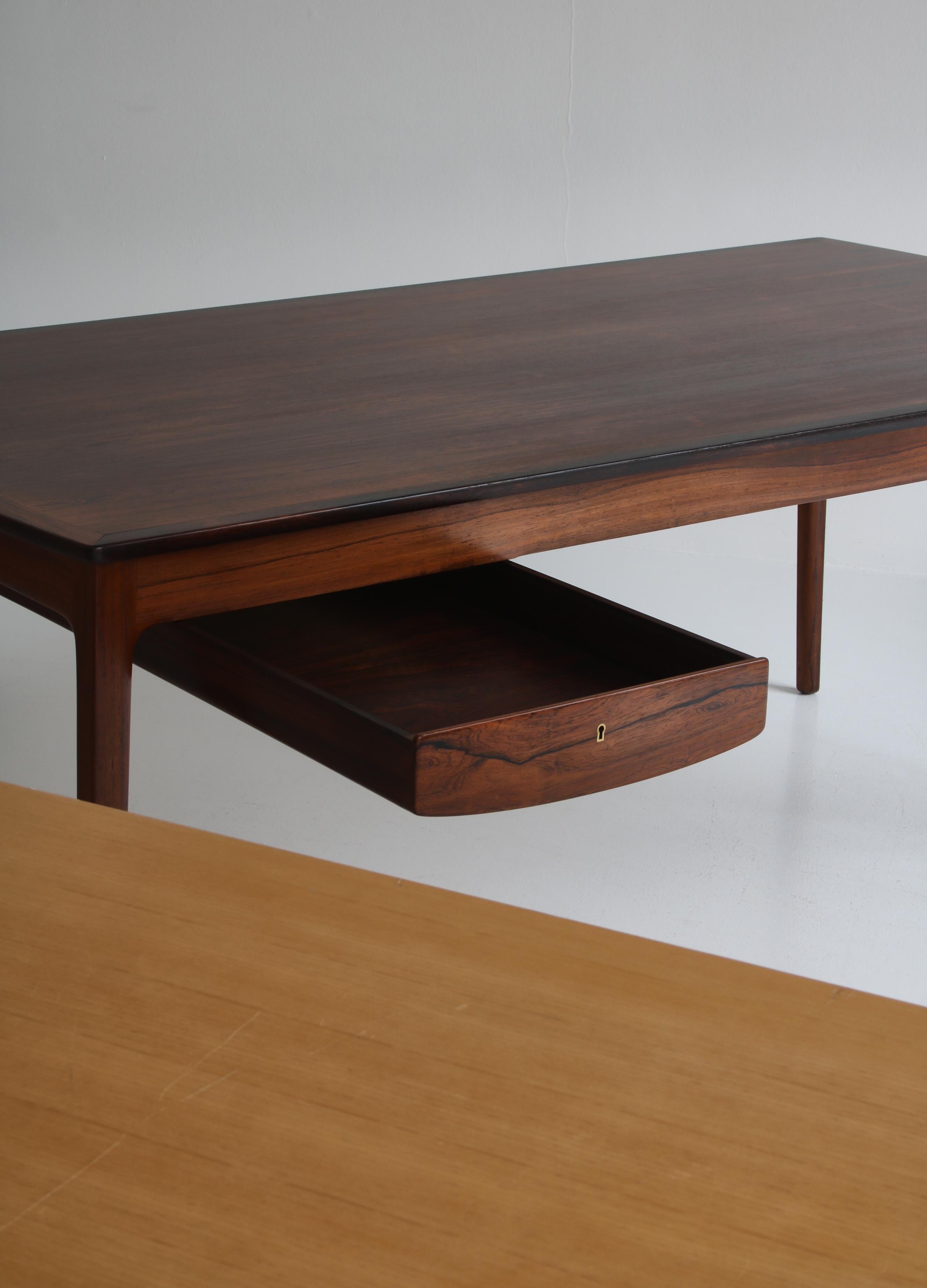 Rare and important desk designed by Ole Wanscher and manufactured at master cabinetmaker A.J. Iversen in 1959. Exhibited at the Danish Cabinetmakers Guild exhibition the same year. The desk is made from exclusive Brazilian Rosewood with the most