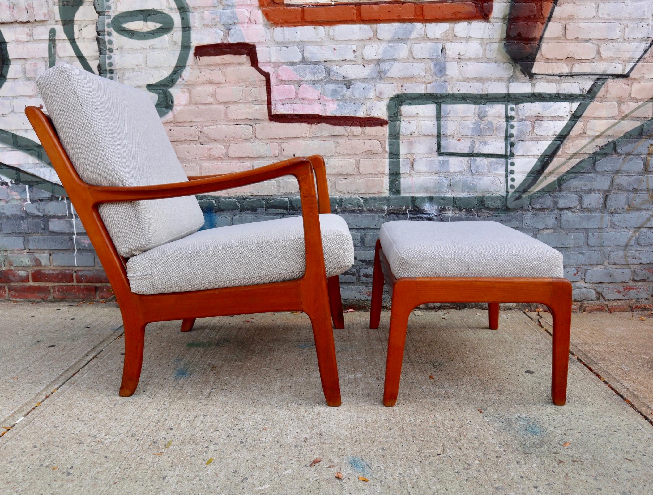 Beautiful lounge chair and ottoman designed by Ole Wanscher for John Stuart. Chair and ottoman both signed. Reupholstered in brand new Maharam textile that plays beautifully with the original bright and warm patine of the wood frame. The chair and