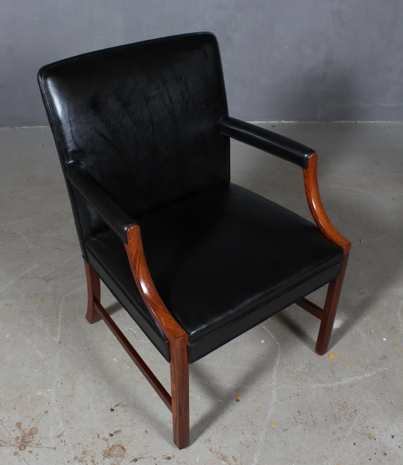 Ole Wanscher lounge chair in original black leather.

Frame of brazilian rosewood.

Made by A. J. Iversen.

  