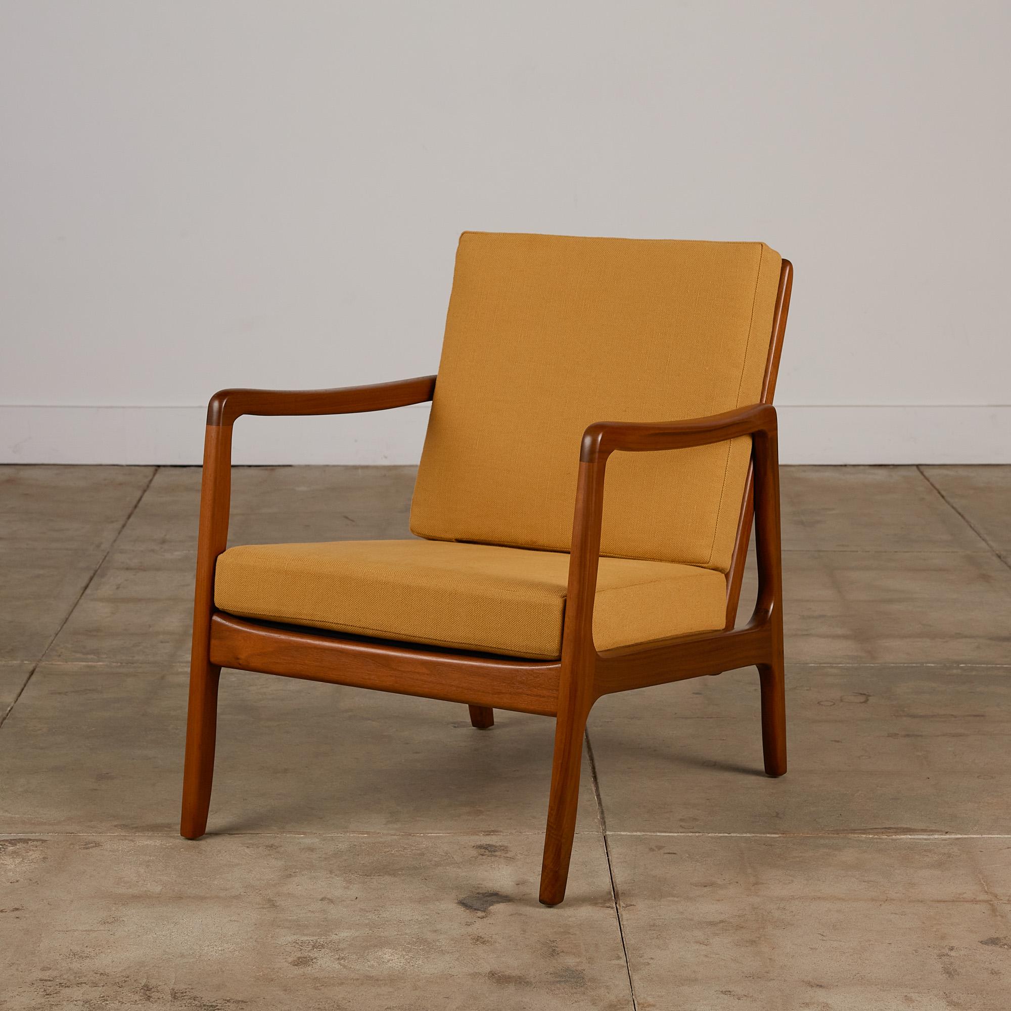 Danish Modern “166” lounge chair by Ole Wanscher for France & Søn, circa 1951. The lounge chair features a sculpted teak frame and slatted teak back support with new ochre yellow linen cushions.

Ole Wanscher was a Danish furniture designer who