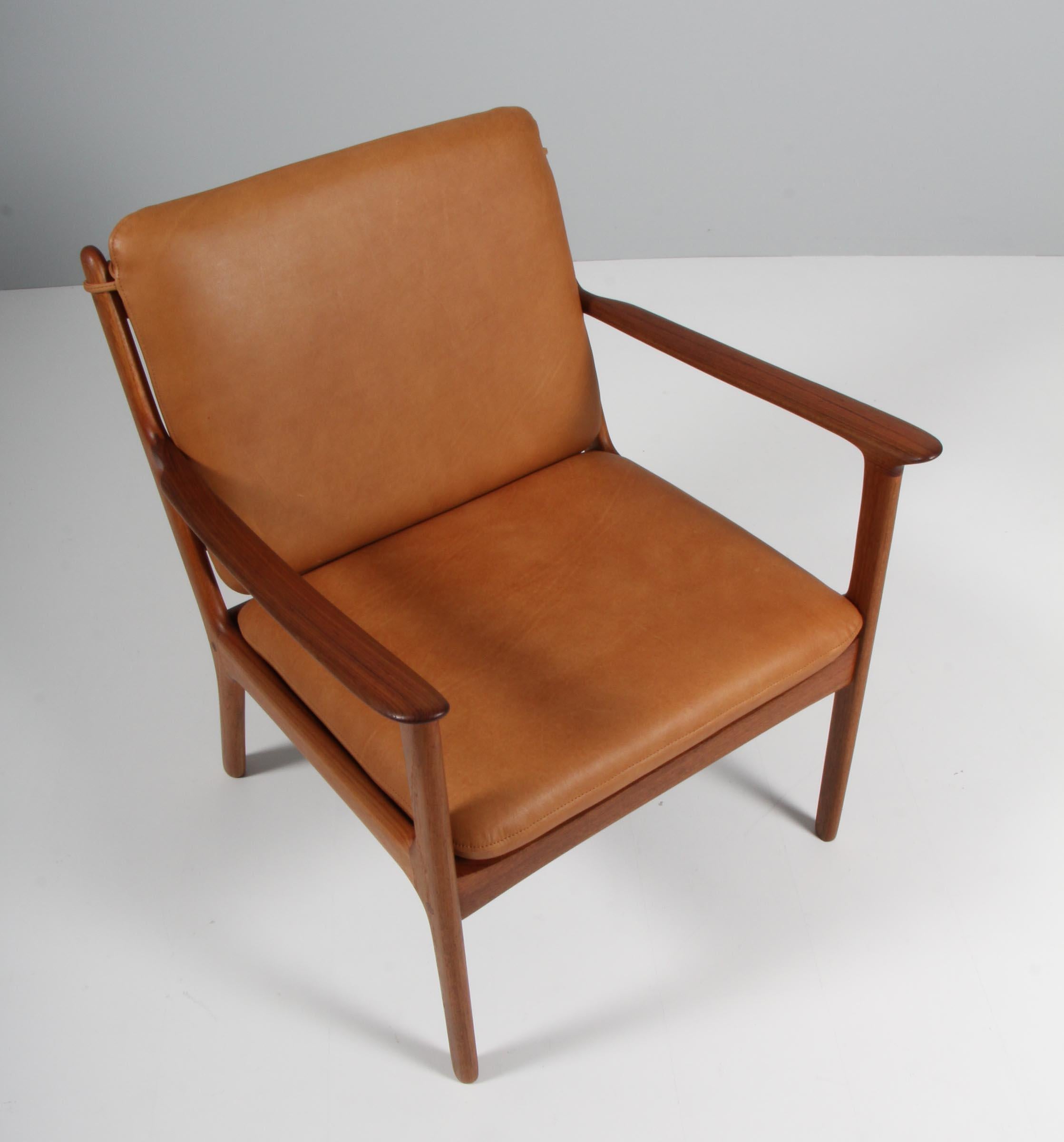 Ole Wanscher lounge chair new upholstered in vintage cognac aniline leather. 

Made of solid teak.

Model PJ 112, made by Poul Jeppesen.

