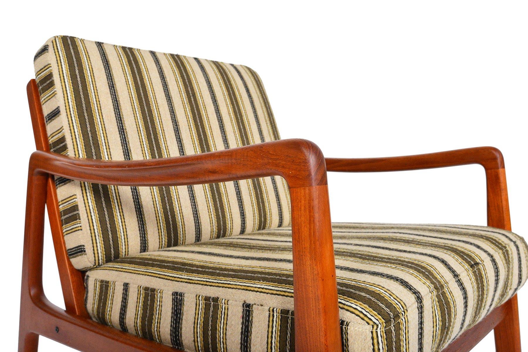 This model 109 teak lounge chair was designed by Ole Wanscher for France & Son in 1951. Crafted in solid teak with elegant lines, this chair is popular with designers and collectors alike. Beautiful and smooth joinery throughout this chair marks its