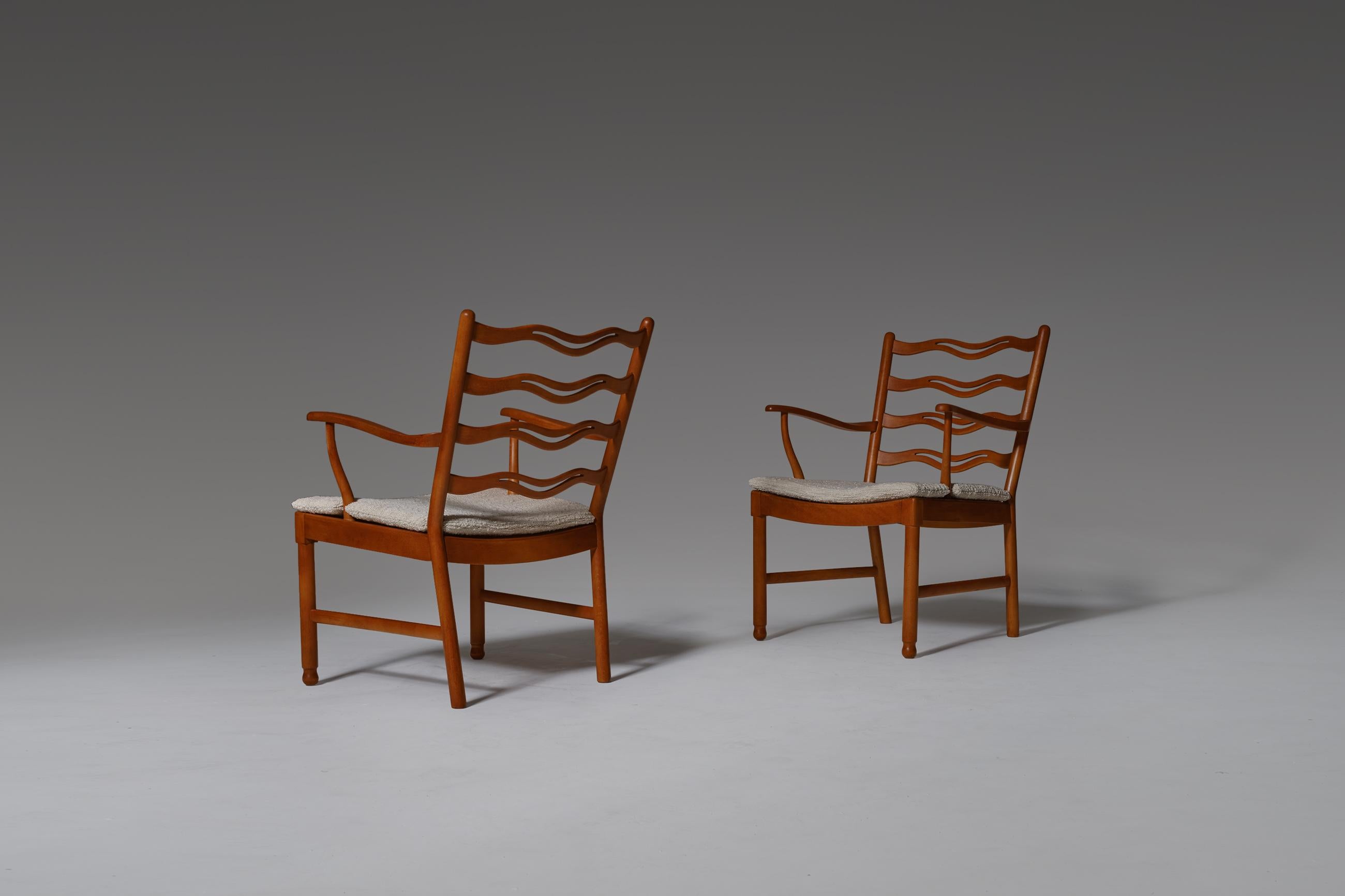 Set of two ‘Model 1755’ armchairs designed by Ole Wanscher, Manufactured by Frits Hansen, Denmark 1946. A modern interpretation of English Furniture out of the Georgian Era. Constructed out of solid beech wood, provided with newly upholstered