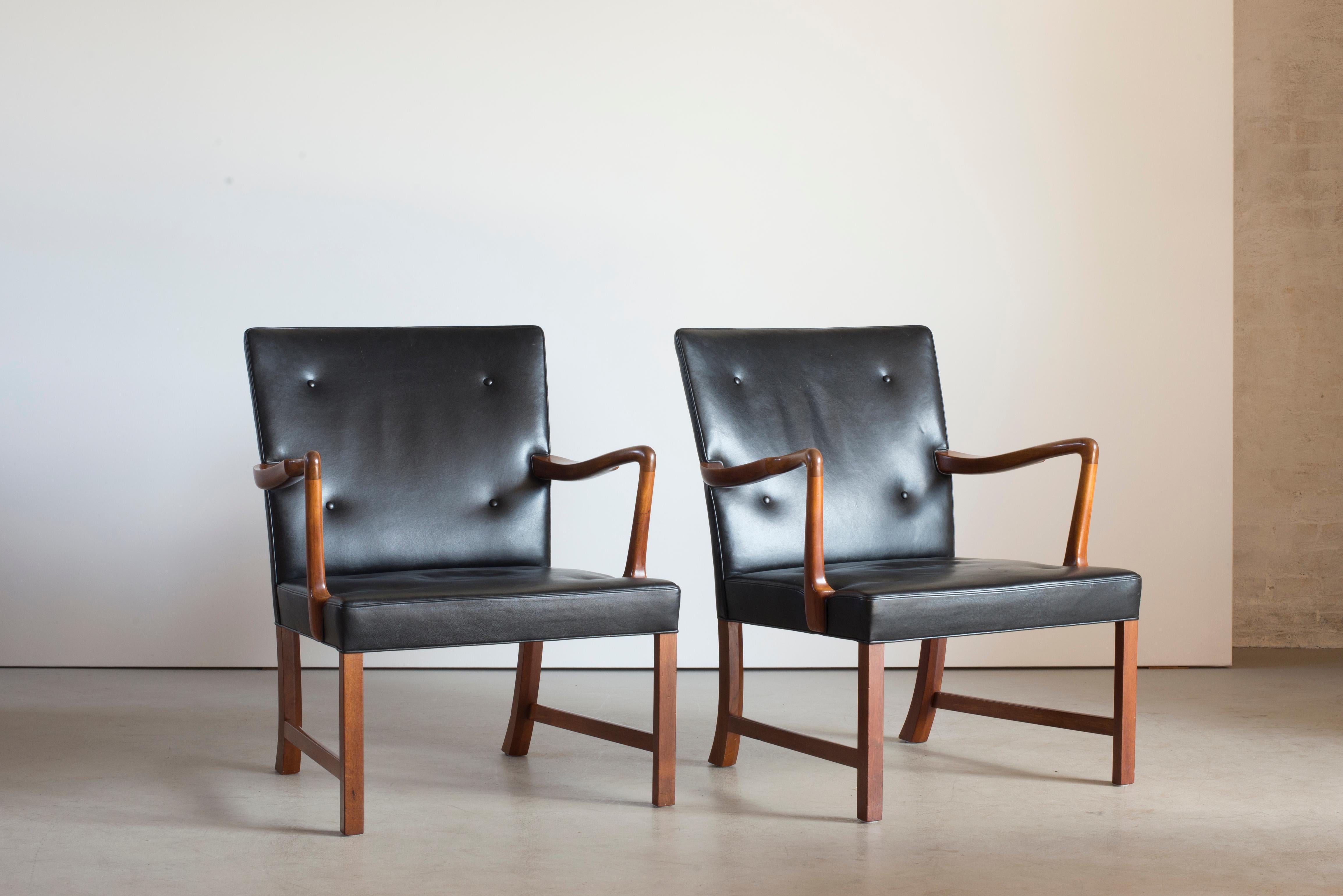 Ole Wanscher pair of armchairs with frame of mahogany. Upholstered with black leather. Executed by A.J. Iversen, Copenhagen, Denmark.