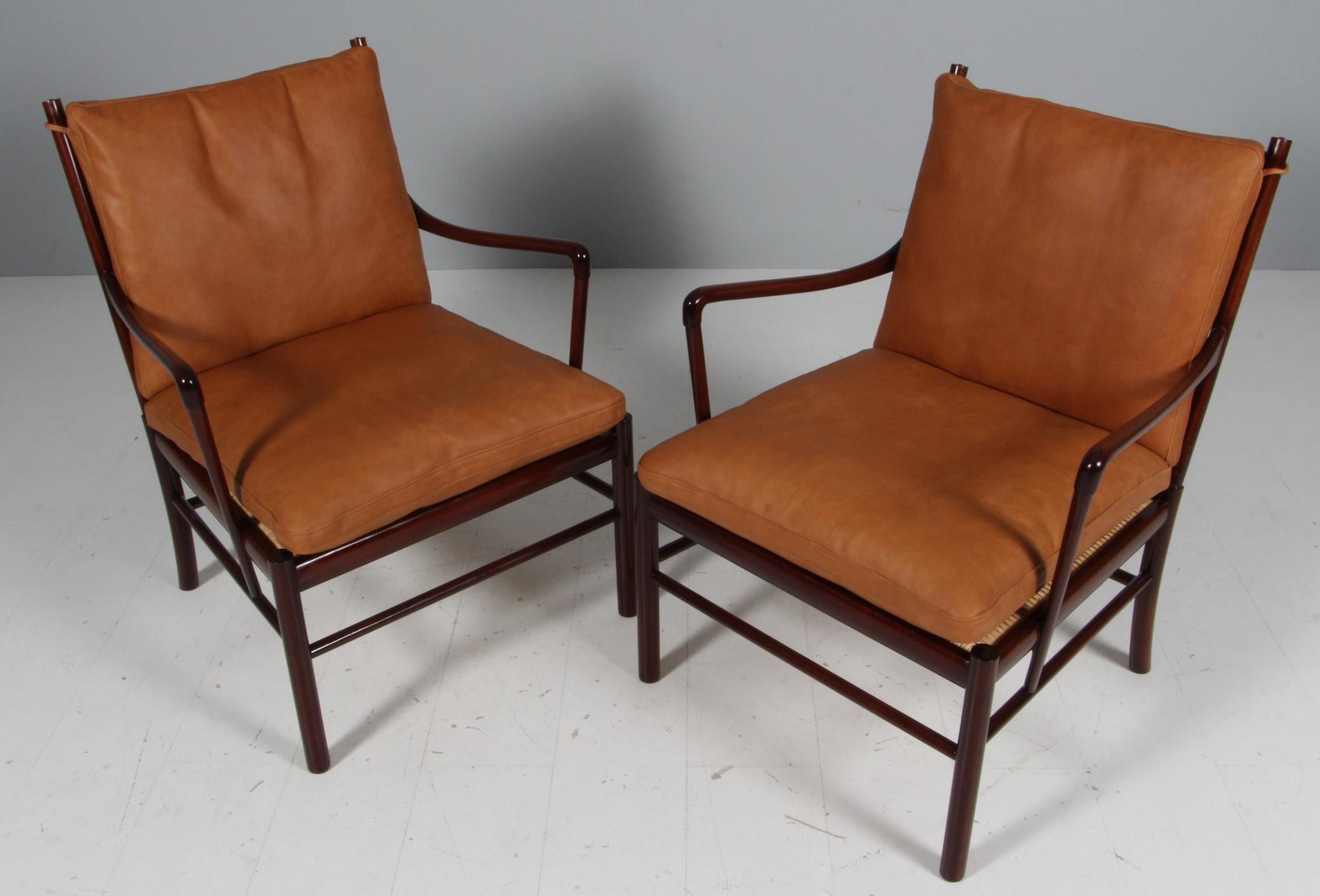 Ole Wanscher pair of lounge chairs new upholstered with cognac vintage aniline leather.

Made in mahogany. 

Model PJ 149 colonial chair, made by Poul Jeppesen.