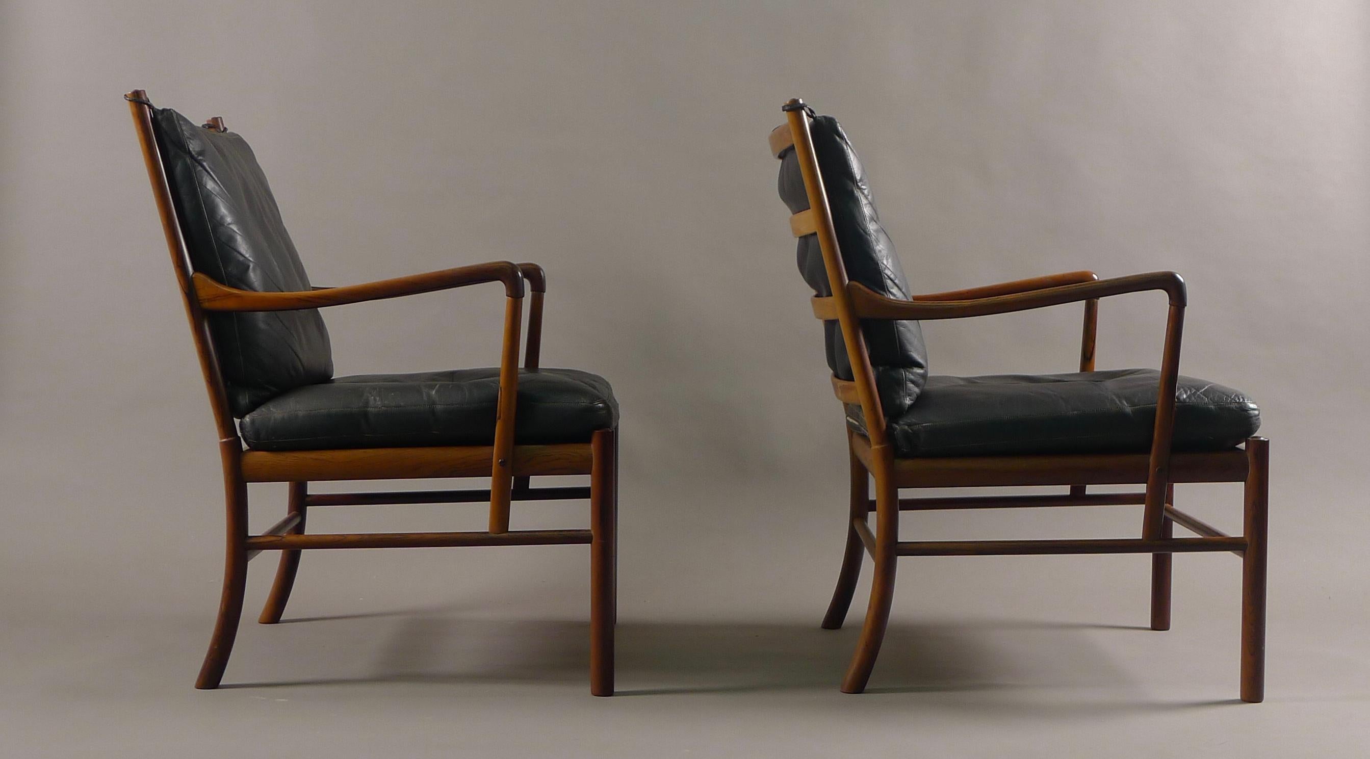 Ole Wanscher for Poul Jeppesens, Mobelfabrik, Denmark, model no. 149, the Colonial chair, designed circa 1950. 

This pair in Brazilian Rosewood with very nice graining to the timber. Original black leather cushions with feather pads, woven cane
