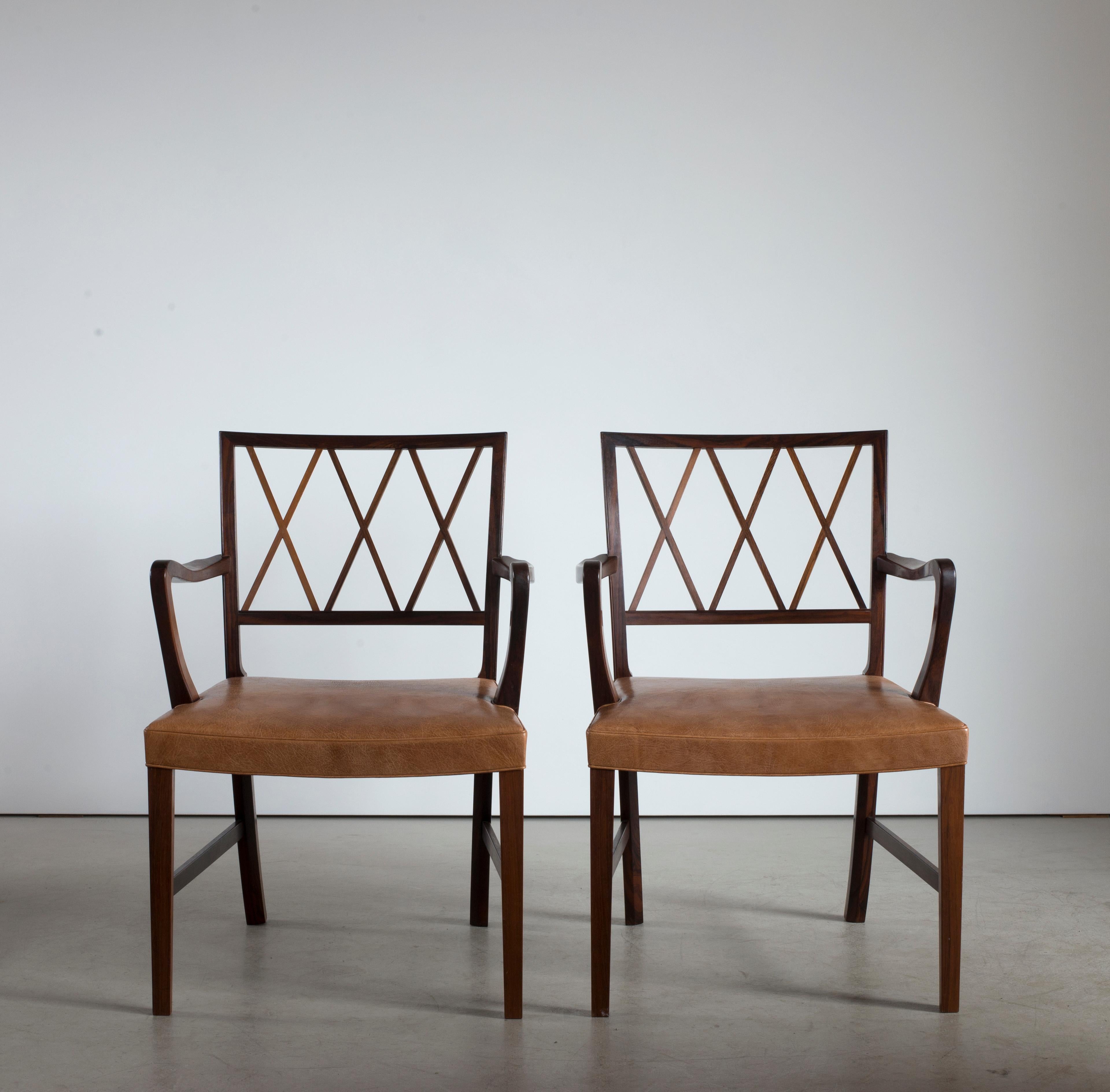 Ole Wanscher pair of armchairs in rosewood and leather. Executed by A. J. Iversen, Copenhagen, Denmark.