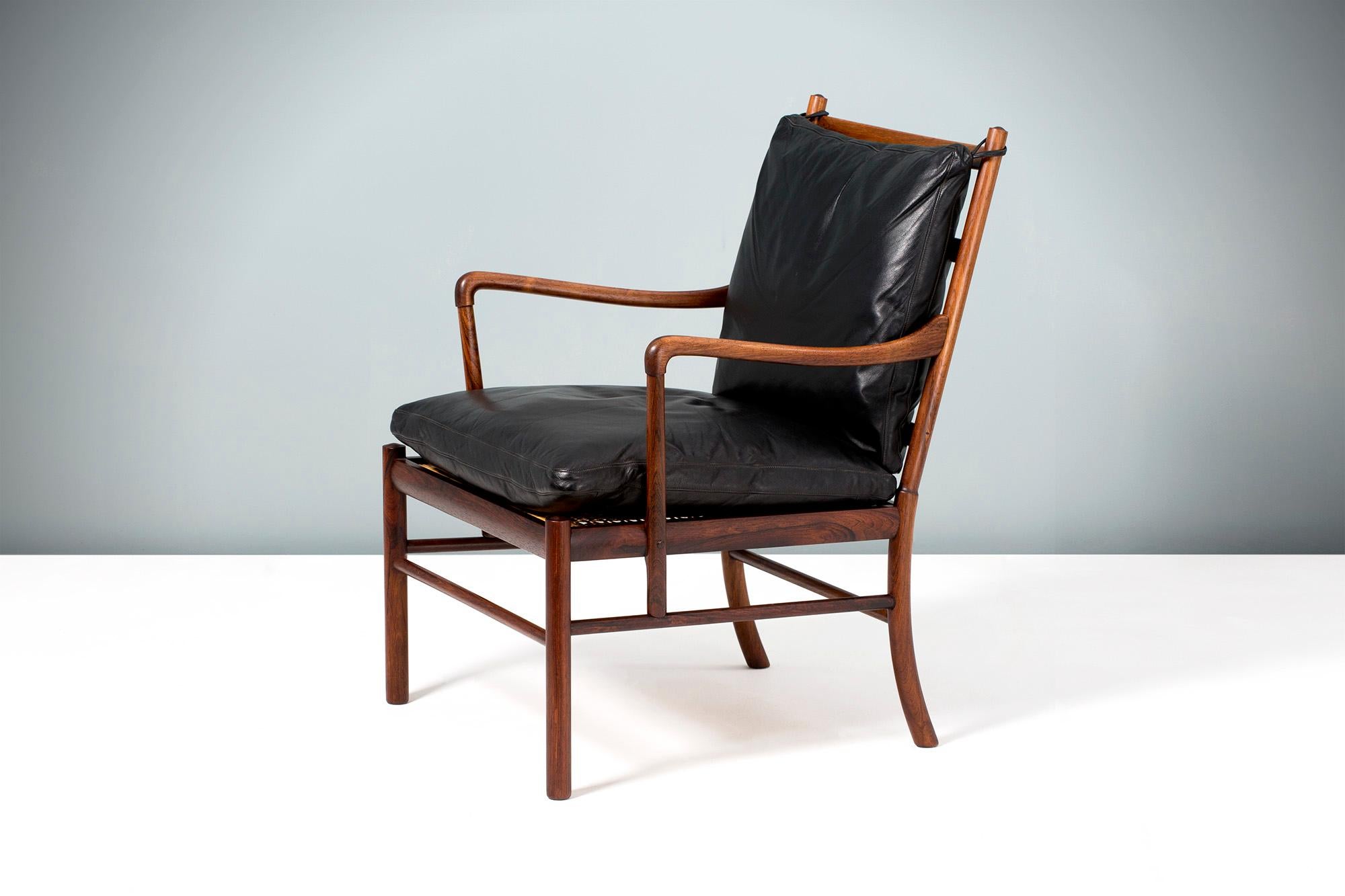 Ole Wanscher

PJ-149 Colonial chair, 1949

A fine pair of Ole Wanscher's most iconic design: The Colonial chair. Produced by Poul Jeppesen in Denmark circa 1950s in exquisite Brazilian rosewood with original woven rattan cane seat and original,