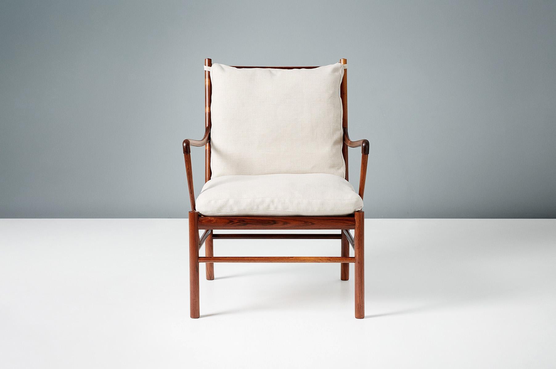Ole Wanscher

PJ-149 Colonial chair, 1949

A fine pair of Ole Wanscher's most iconic design: The colonial chair. Produced by Poul Jeppesen in Denmark circa 1950s in exquisite Brazilian rosewood with original woven rattan cane seat and feather