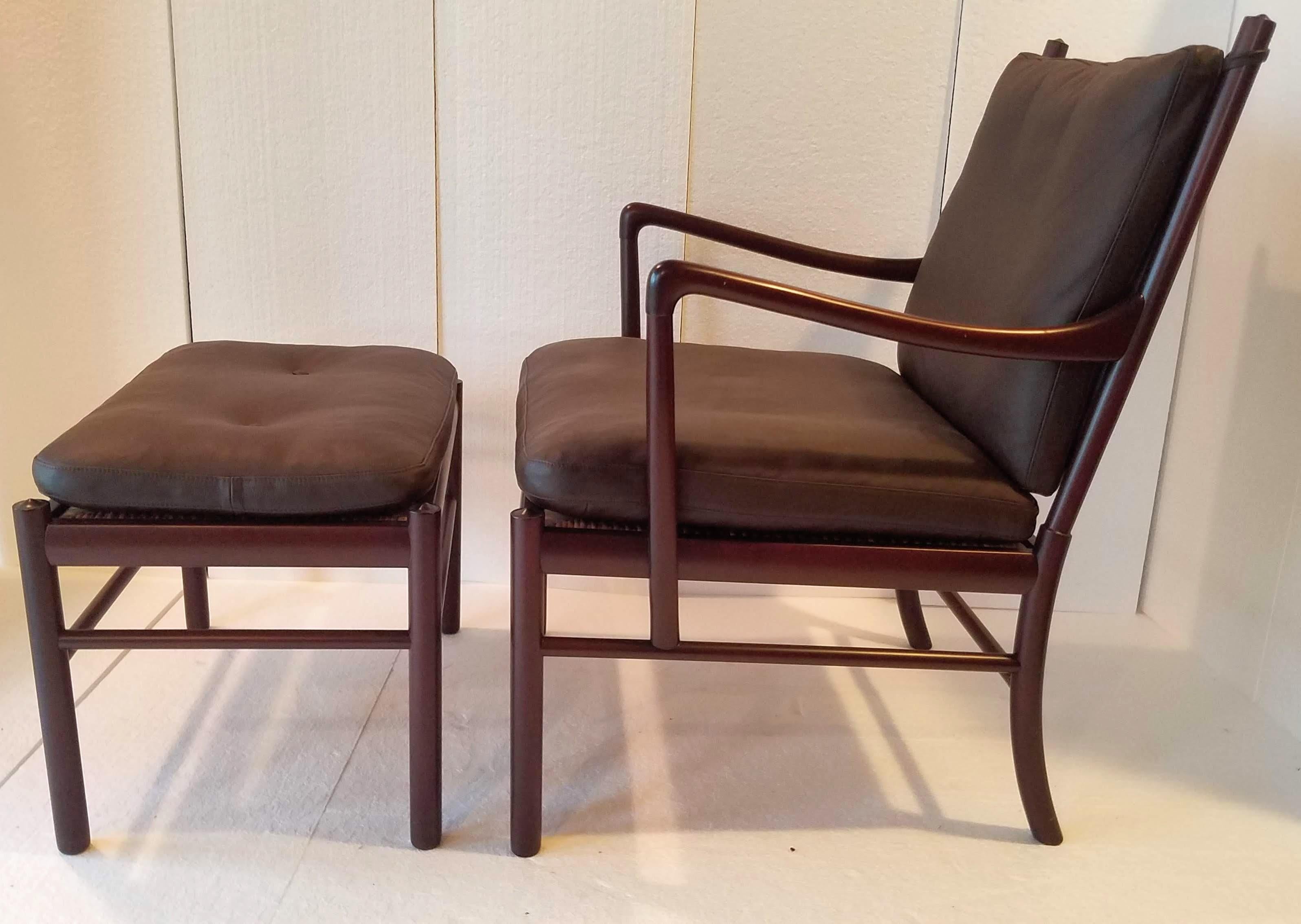 Ole Wanscher’s classic Danish modern rosewood framed lounge chair and matching ottoman from the 1960s. 
This elegantly designed armchair and ottoman by Ole Wanscher and produced by Poul Jeppesen Møbelfabrik in Denmark is a classic of the 1960s.